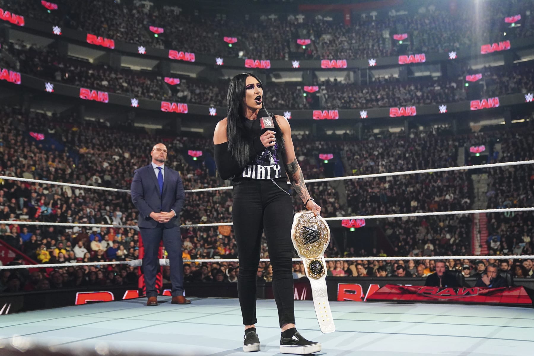 MONTREAL, CANADA - APRIL 15: Rhea Ripley relinquishes the Women's World Championship during Monday Night RAW at the Bell Centre on April 15, 2024 in Montreal, Canada. (Photo by WWE/Getty Images)