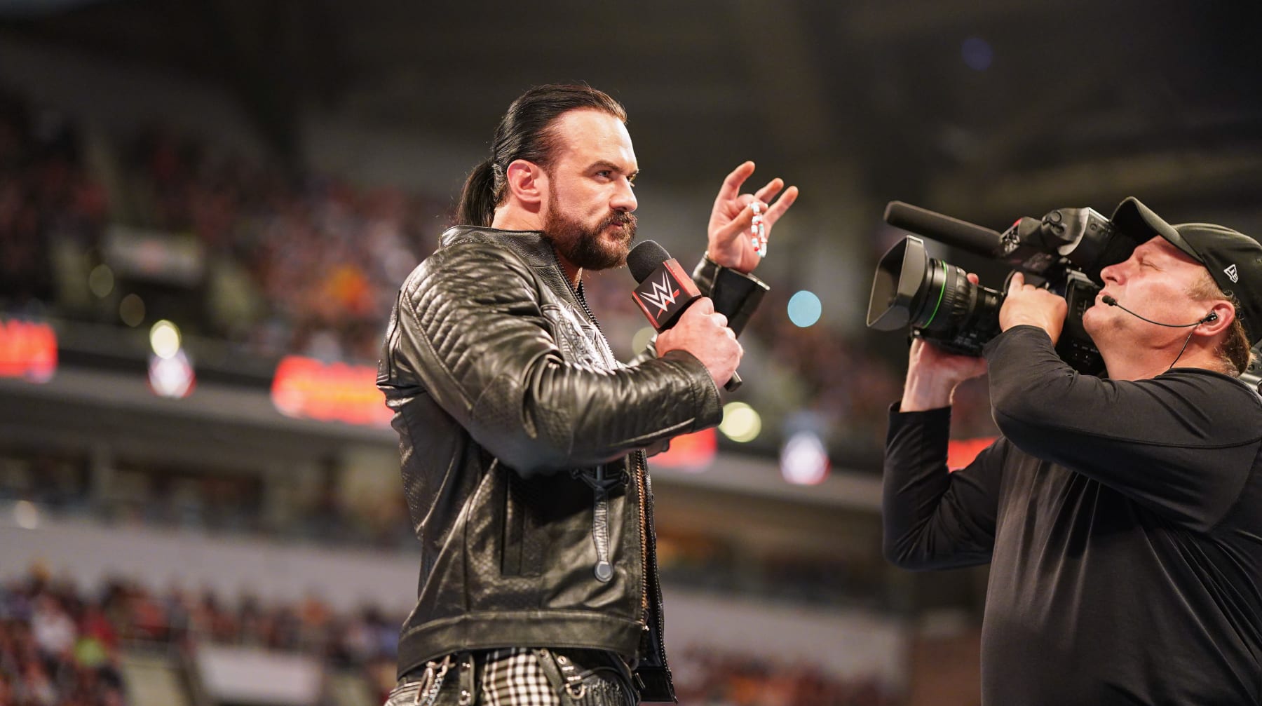 INDIANAPOLIS, INDIANA - JUNE 24: Drew McIntyre speaks while holding CM Punk's bracelet during Monday Night RAW at Gainbridge Fieldhouse on June 24, 2024 in Indianapolis, Indiana. (Photo by WWE/Getty Images)