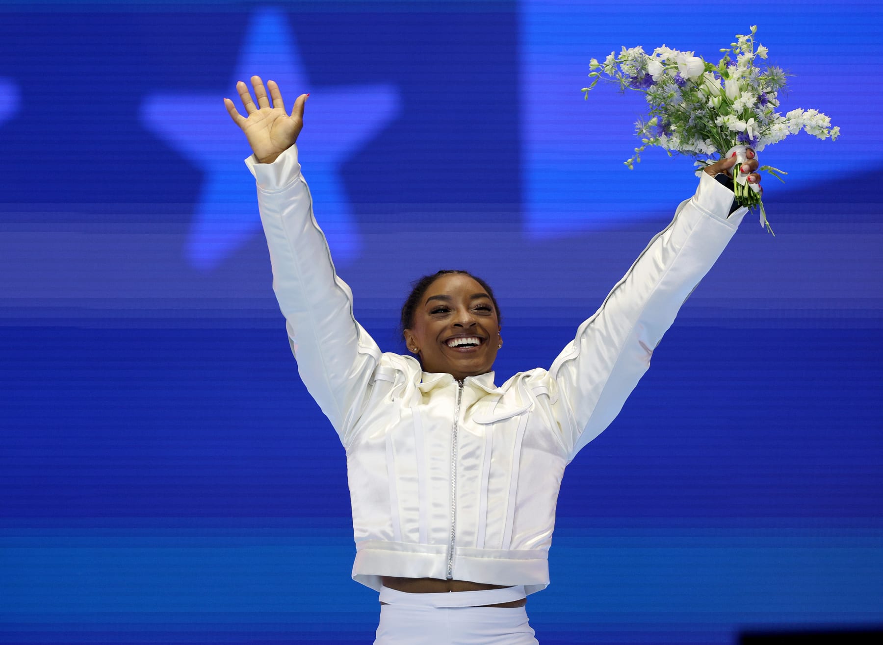MINNEAPOLIS, MINNESOTA - JUNE 30:  Simone Biles celebrates as she is announced as a member of the Olympic Team on Day Four of the 2024 U.S. Olympic Team Gymnastics Trials at Target Center on June 30, 2024 in Minneapolis, Minnesota. (Photo by Elsa/Getty Images)