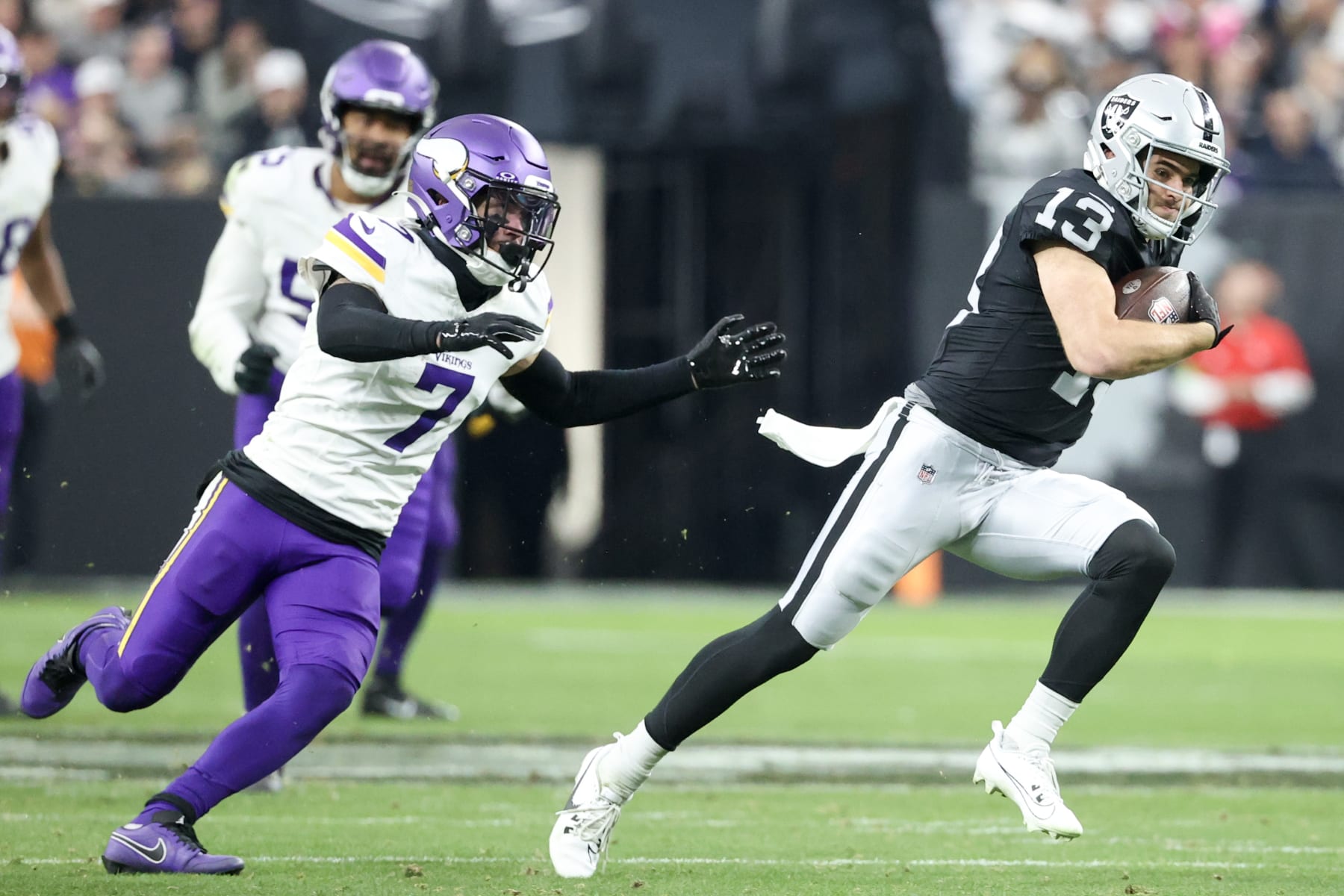 LAS VEGAS, NEVADA - DECEMBER 10: Hunter Renfrow #13 of the Las Vegas Raiders runs past Byron Murphy Jr. #7 of the Minnesota Vikings during the third quarter at Allegiant Stadium on December 10, 2023 in Las Vegas, Nevada. (Photo by Ian Maule/Getty Images)