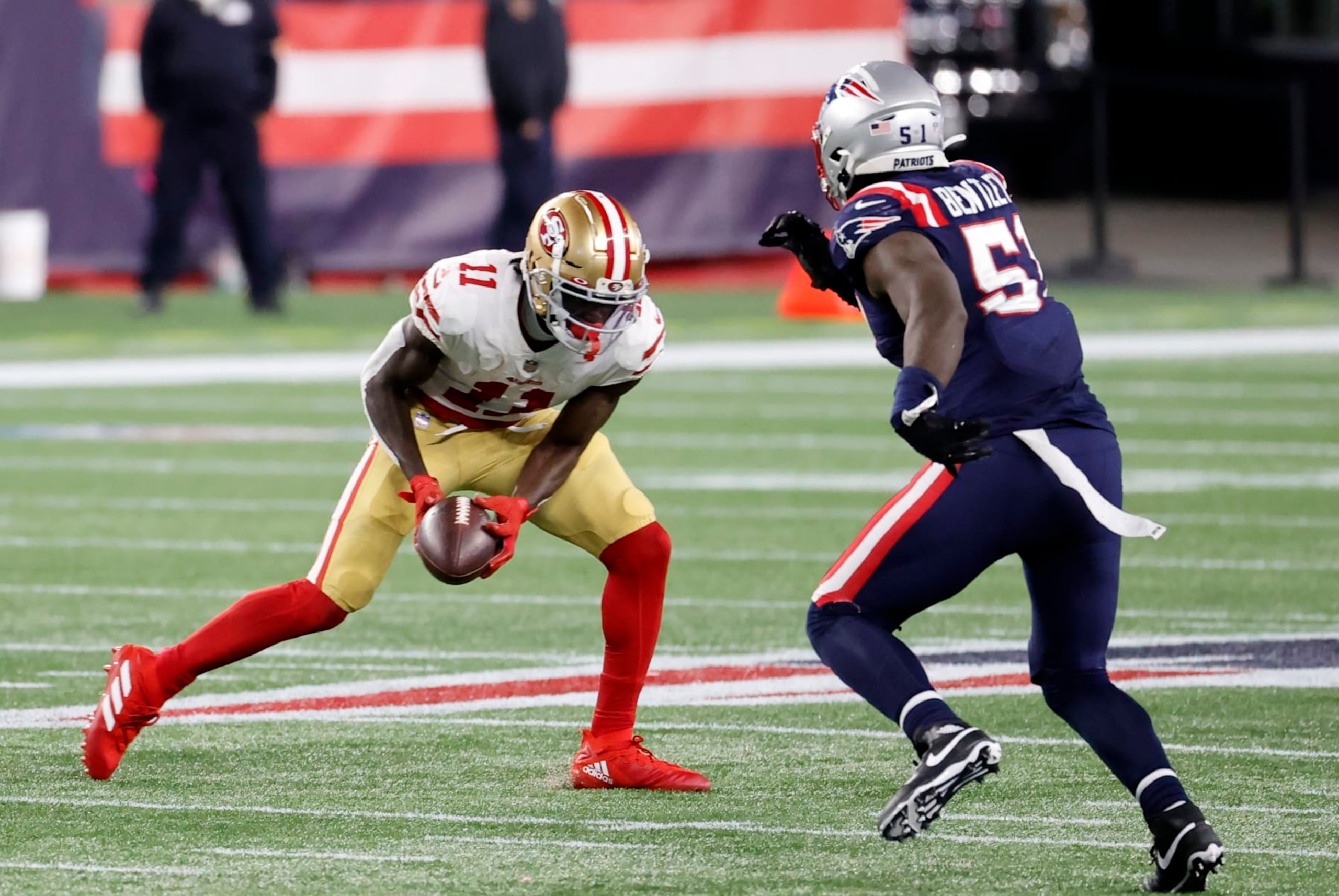 FOXBOROUGH, MA - OCTOBER 25: San Francisco 49ers wide receiver Brandon Aiyuk (11) makes a catch watched by New England Patriots linebacker Ja'Whaun Bentley (51) during a game between the New England Patriots and the San Francisco 49ers on October 25, 2020, at Gillette Stadium in Foxborough, Massachusetts. (Photo by Fred Kfoury III/Icon Sportswire via Getty Images)
