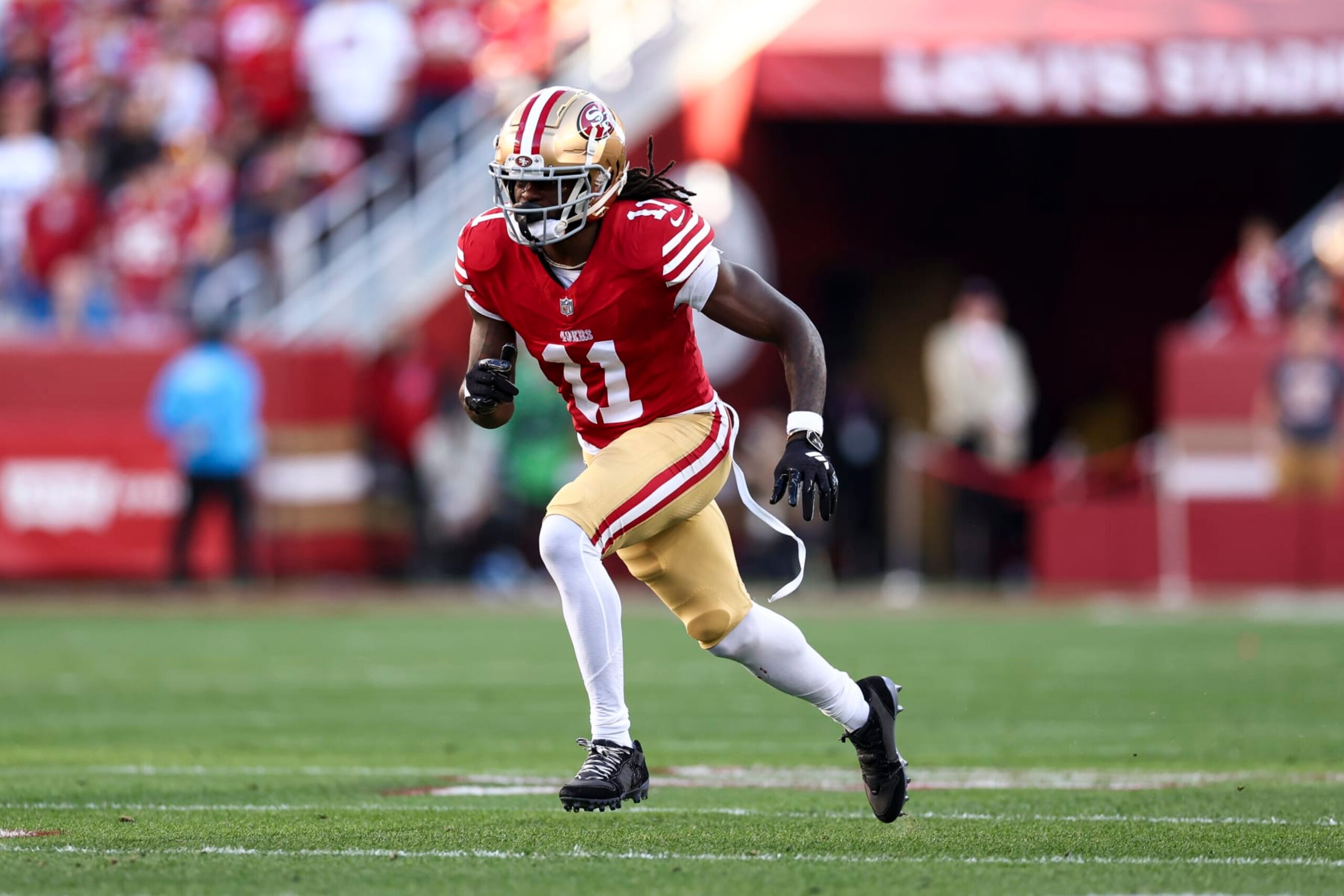 SANTA CLARA, CA - JANUARY 28: Brandon Aiyuk #11 of the San Francisco 49ers runs downfield during the NFC Championship NFL football game against the Detroit Lions at Levi's Stadium on January 28, 2024 in Santa Clara, California. (Photo by Kevin Sabitus/Getty Images)