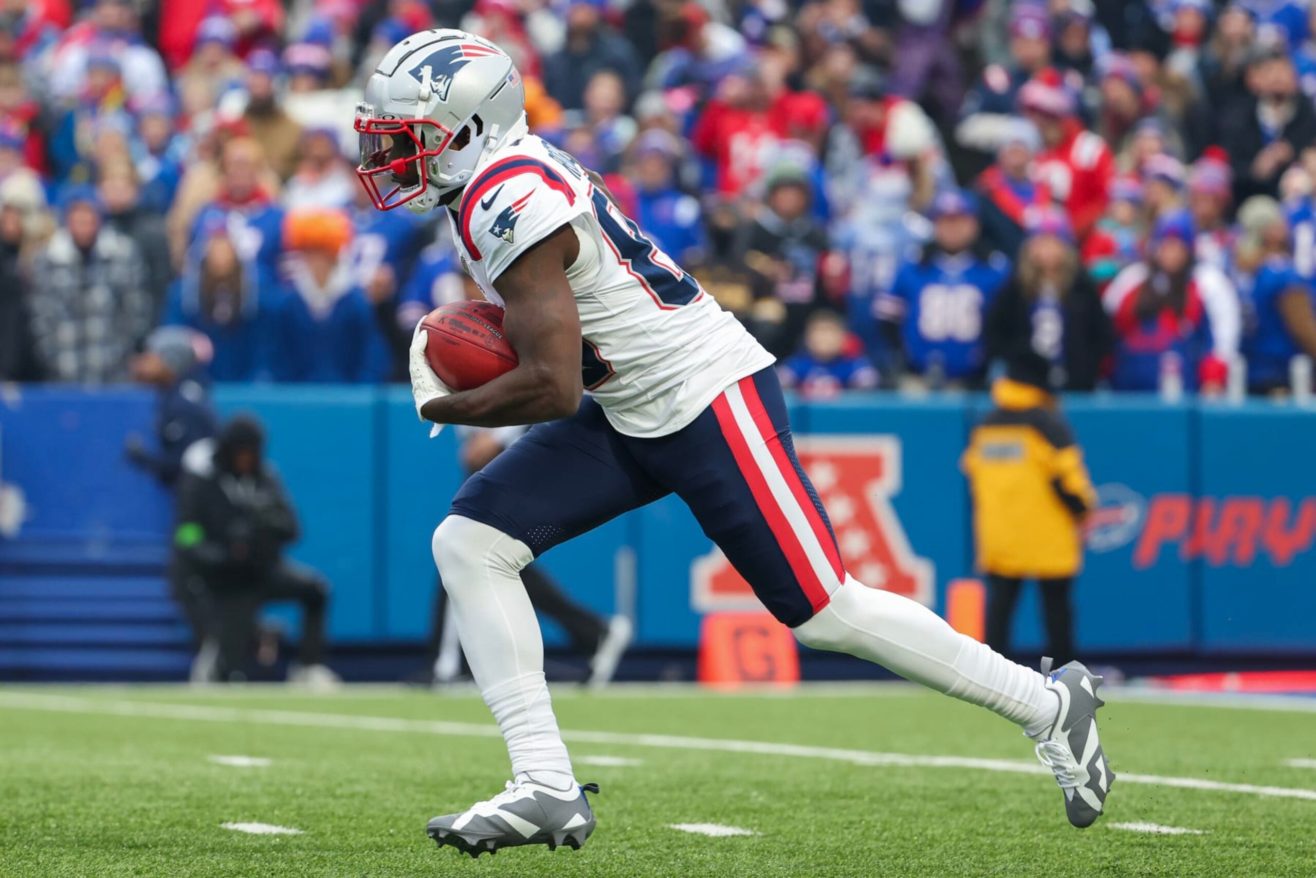 ORCHARD PARK, NEW YORK - DECEMBER 31: Jalen Reagor #83 of the New England Patriots runs the kickoff back for a touchdown  during the first quarter of a game against the Buffalo Bills at Highmark Stadium on December 31, 2023 in Orchard Park, New York. (Photo by Timothy T Ludwig/Getty Images)