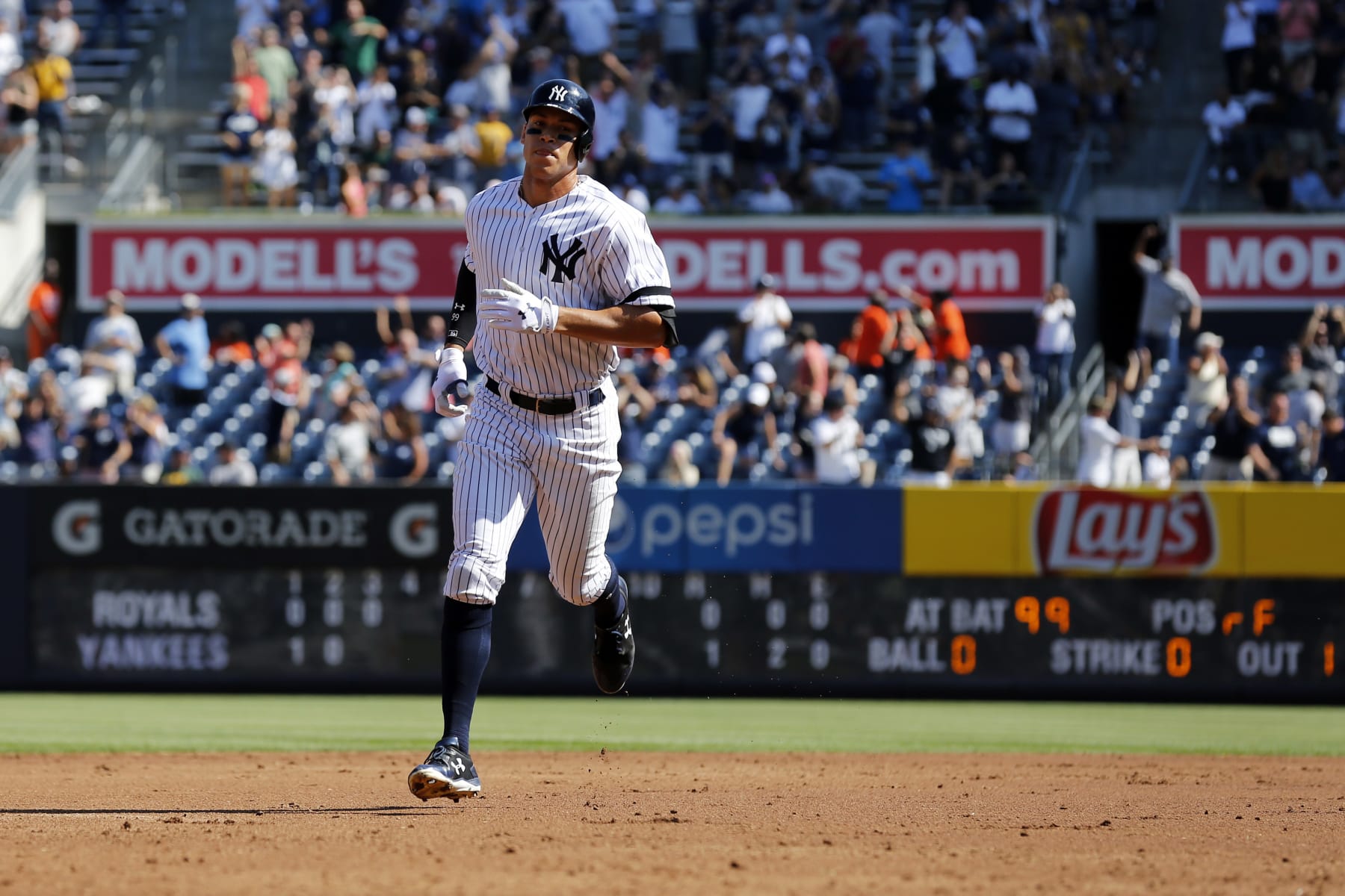 NEW YORK, NY - SEPTEMBER 25: Aaron Judge #99 of the New York Yankees rounds the bases after hitting a two-run home run against the Kansas City Royals during the third inning at Yankee Stadium on September 25, 2017 in the Bronx borough of New York City. The home run was number 49 of the season tying the record. (Photo by Adam Hunger/Getty Images)
