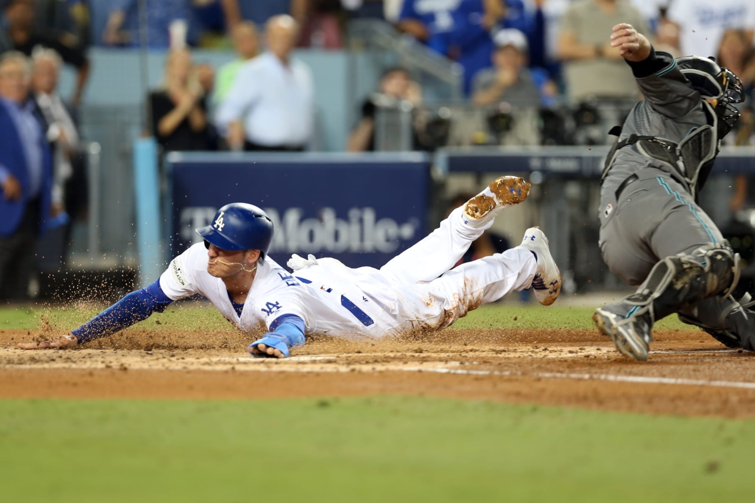 LOS ANGELES, CA - OCTOBER 6:  Cody Bellinger #35 of the Los Angeles Dodgers slides safely into home to score a run in the first inning during Game 1 of the National League Division Series against the Arizona Diamondbacks at Dodger Stadium on Friday, October 6, 2017 in Los Angeles, California. (Photo by Rob Leiter/MLB via Getty Images) 