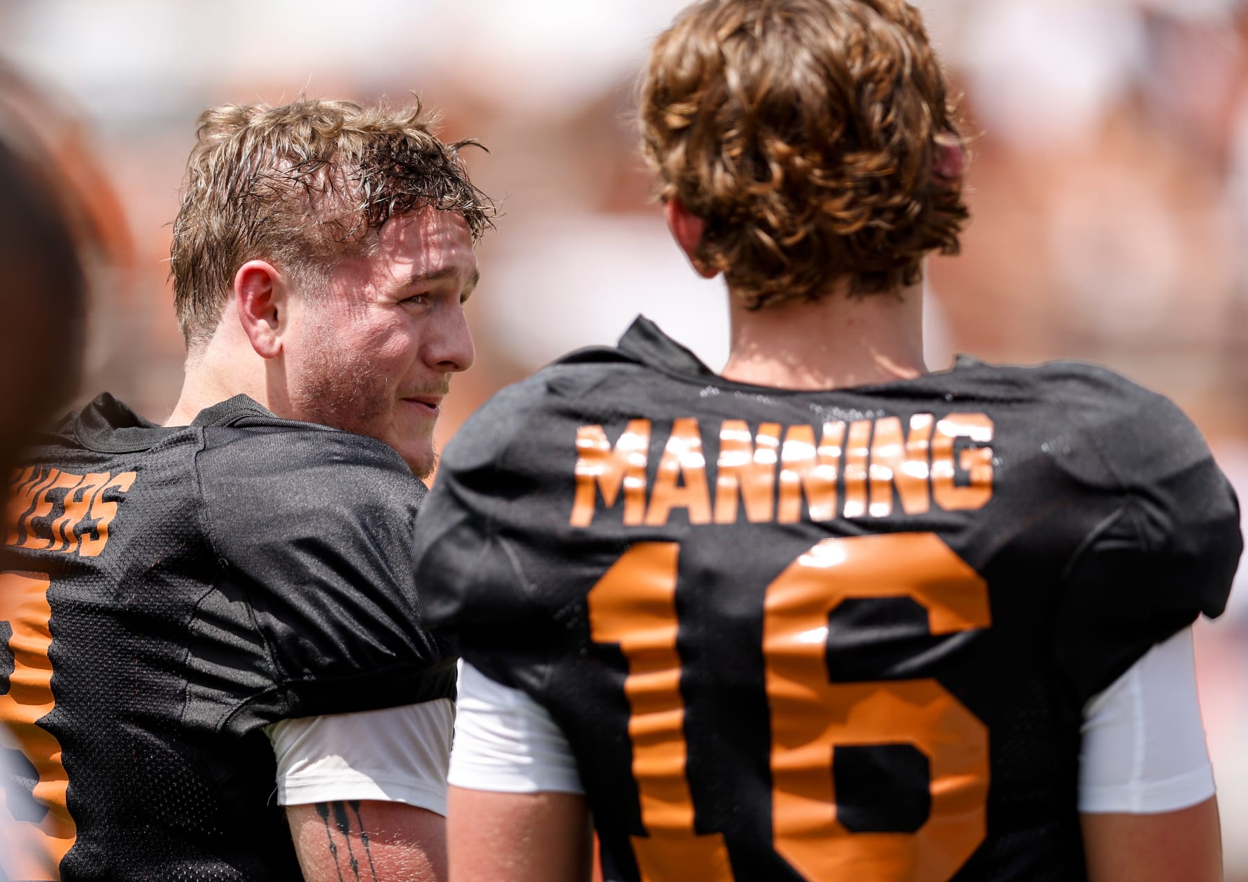 AUSTIN, TEXAS - APRIL 15: Quinn Ewers #3 of the Texas Longhorns talks with Arch Manning #16 during the Texas Football Orange-White Spring Football Game at Darrell K Royal-Texas Memorial Stadium on April 15, 2023 in Austin, Texas. (Photo by Tim Warner/Getty Images)
