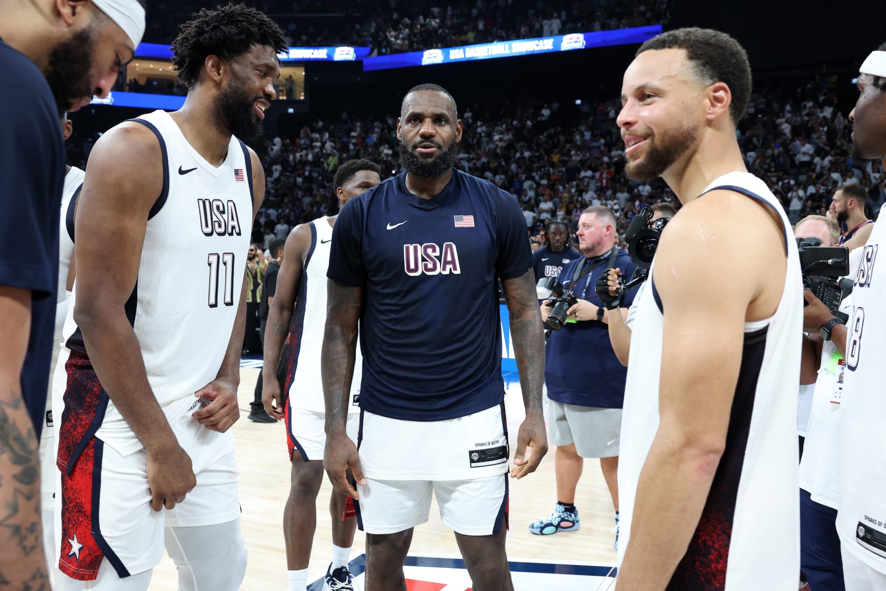 ABU DHABI, UNITED ARAB EMIRATES - JULY 17:  Joel Embiid #11, LeBron James #6, Stephen Curry #4 and Derrick White #8 of the United States after an exhibition game between the United States and Serbia ahead of the Paris Olympic Games at Etihad Arena on July 17, 2024 in Abu Dhabi, United Arab Emirates. (Photo by Christopher Pike/Getty Images)