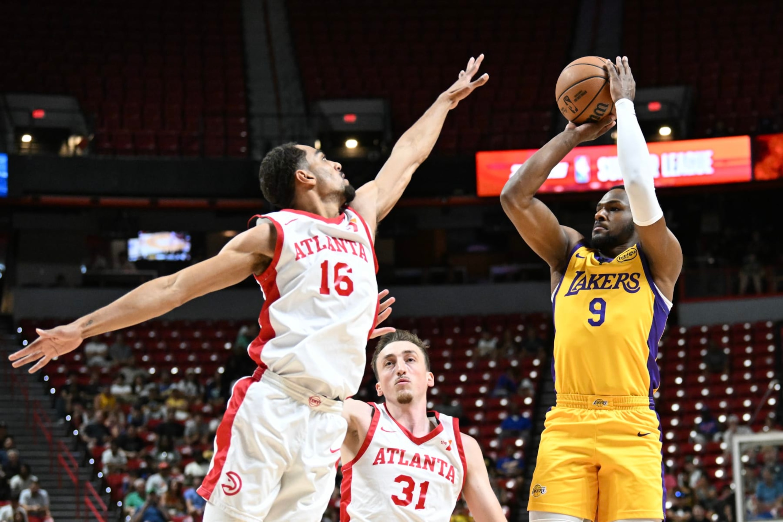 LAS VEGAS, NEVADA - JULY 17: Bronny James Jr. #9 of the Los Angeles Lakers scores against Emmitt Matthews Jr. #16 of the Atlanta Hawks in the first half of a 2024 NBA Summer League game at the Thomas & Mack Center on July 17, 2024 in Las Vegas, Nevada. NOTE TO USER: User expressly acknowledges and agrees that, by downloading and or using this photograph, User is consenting to the terms and conditions of the Getty Images License Agreement. (Photo by Candice Ward/Getty Images) LAS VEGAS, NEVADA - JULY 17: Bronny James Jr. #9 of the Los Angeles Lakers scores against Emmitt Matthews Jr. #16 of the Atlanta Hawks in the first half of a 2024 NBA Summer League game at the Thomas & Mack Center on July 17, 2024 in Las Vegas, Nevada. NOTE TO USER: User expressly acknowledges and agrees that, by downloading and or using this photograph, User is consenting to the terms and conditions of the Getty Images License Agreement. (Photo by Candice Ward/Getty Images)