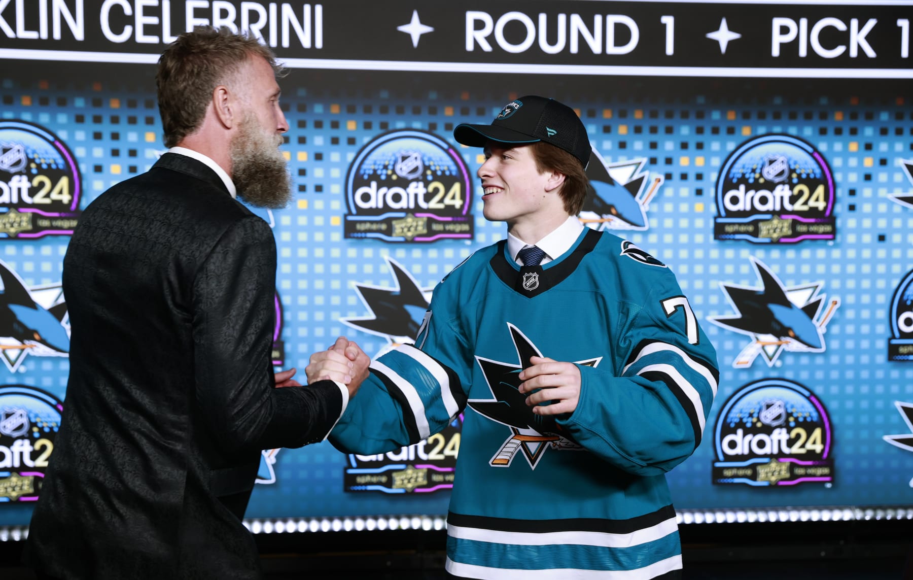 LAS VEGAS, NEVADA - JUNE 28: Macklin Celebrini shakes the hand of Joe Thornton onstage after being selected first overall by the San Jose Sharks during the first round of the 2024 Upper Deck NHL Draft at Sphere on June 28, 2024 in Las Vegas, Nevada. (Photo by Jeff Vinnick/NHLI via Getty Images)