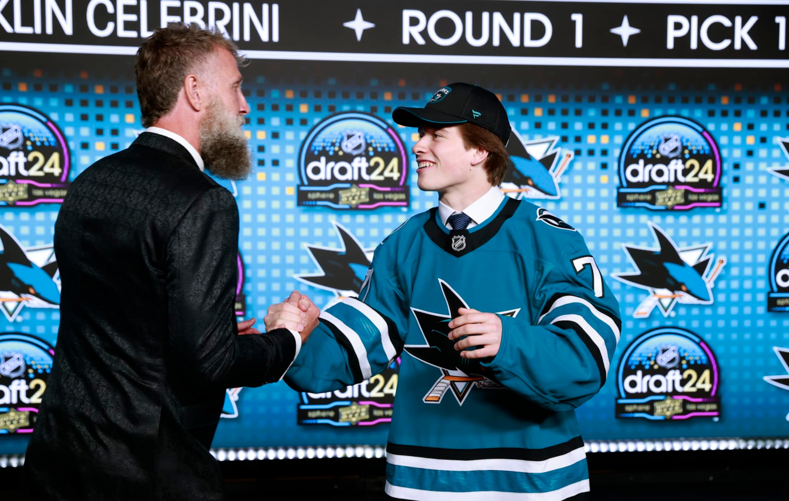 LAS VEGAS, NEVADA - JUNE 28: Macklin Celebrini shakes the hand of Joe Thornton onstage after being selected first overall by the San Jose Sharks during the first round of the 2024 Upper Deck NHL Draft at Sphere on June 28, 2024 in Las Vegas, Nevada. (Photo by Jeff Vinnick/NHLI via Getty Images) LAS VEGAS, NEVADA - JUNE 28: Macklin Celebrini shakes the hand of Joe Thornton onstage after being selected first overall by the San Jose Sharks during the first round of the 2024 Upper Deck NHL Draft at Sphere on June 28, 2024 in Las Vegas, Nevada. (Photo by Jeff Vinnick/NHLI via Getty Images)