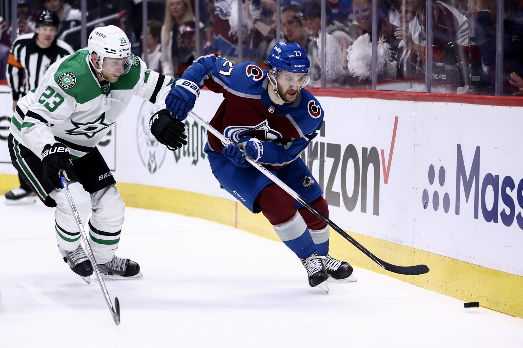DENVER, COLORADO - MAY 17: Jonathan Drouin #27 of the Colorado Avalanche skates against Esa Lindell #23 of the Dallas Stars during the first overtime period in Game Six of the Second Round of the 2024 Stanley Cup Playoffs at Ball Arena on May 17, 2024 in Denver, Colorado.  (Photo by Tyler Schank/Clarkson Creative/Getty Images)