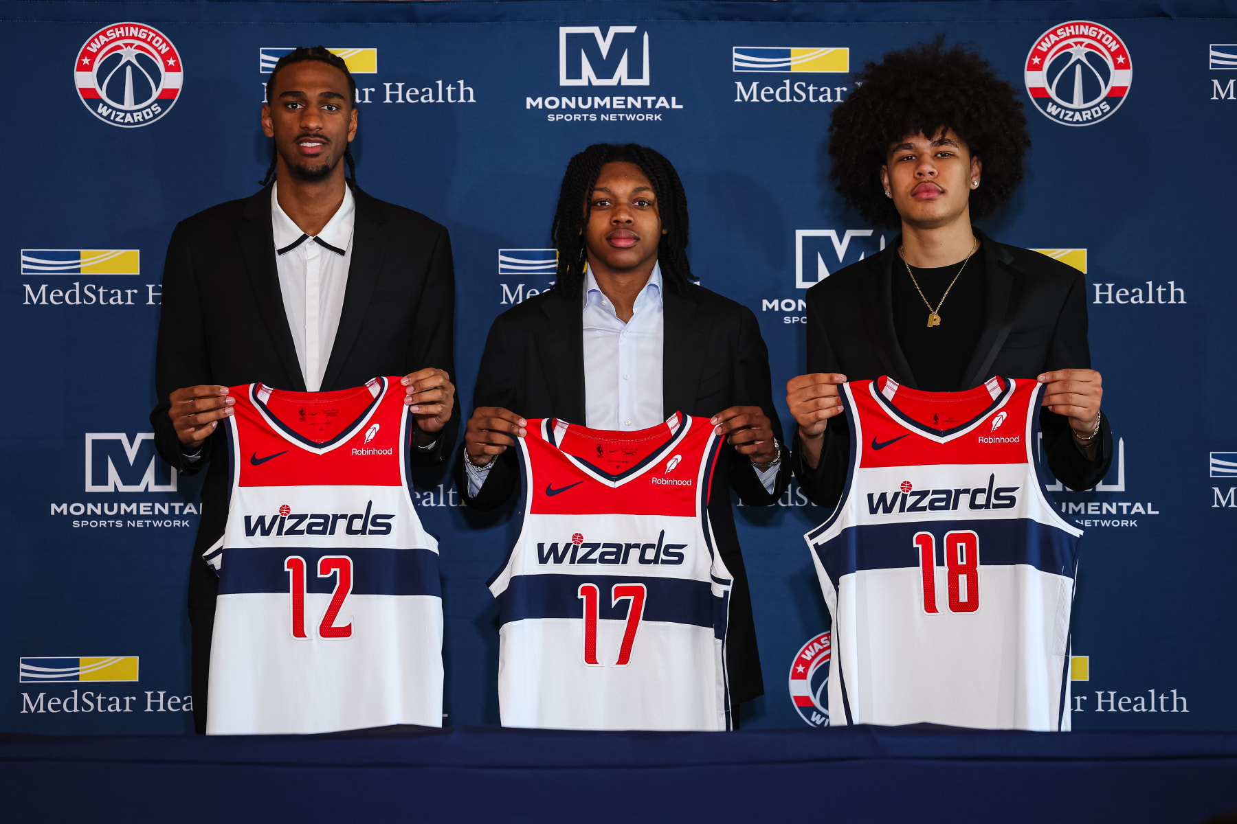 WASHINGTON, DC - JUNE 29: (L-R) 2024 draft picks Alex Sarr #12, Bub Carrington #17, and Kyshawn George #18 of the Washington Wizards are introduced at Union Station on June 29, 2024 in Washington, DC. NOTE TO USER: User expressly acknowledges and agrees that, by downloading and or using this photograph, User is consenting to the terms and conditions of the Getty Images License Agreement. (Photo by Scott Taetsch/Getty Images)