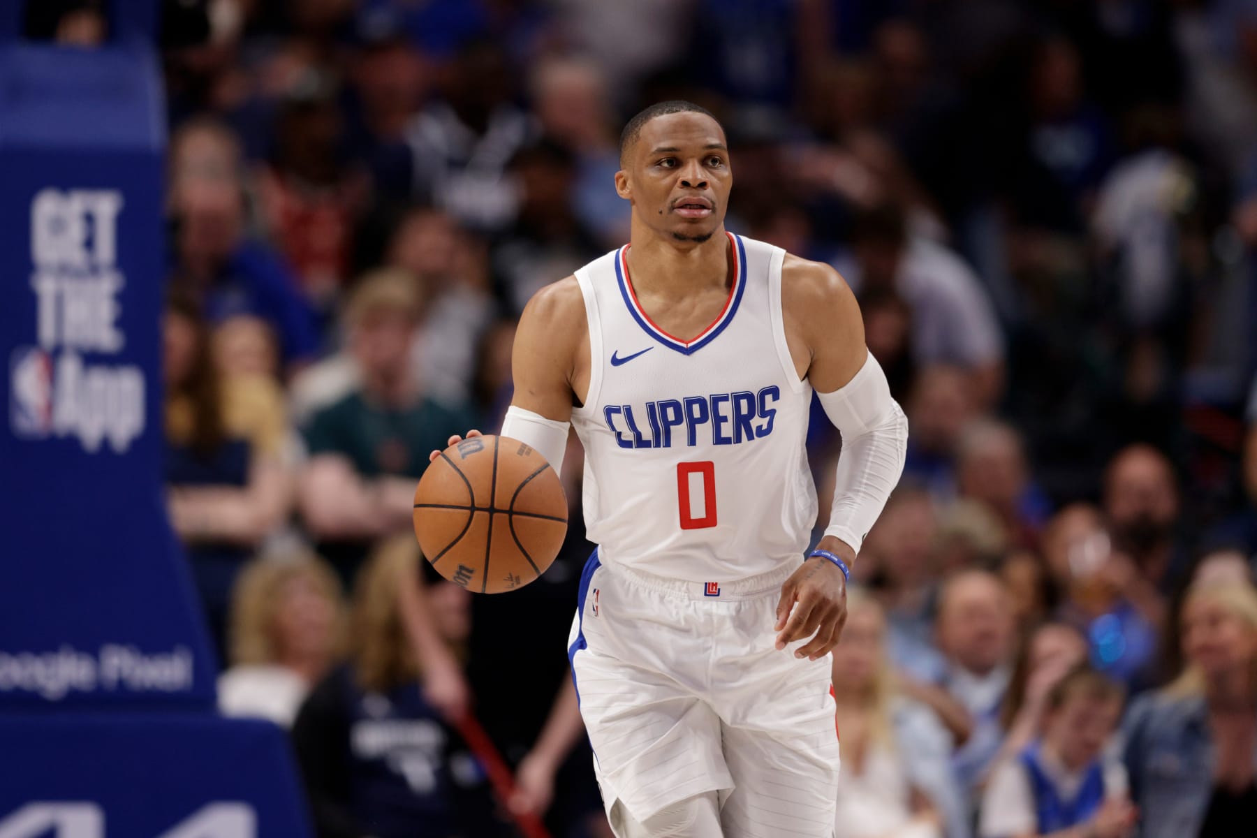 DALLAS, TEXAS - APRIL 28: Russell Westbrook #0 of the Los Angeles Clippers brings the ball up court in the second half of game four of the Western Conference First Round Playoffs against the Dallas Mavericks at American Airlines Center on April 28, 2024 in Dallas, Texas.  NOTE TO USER: User expressly acknowledges and agrees that, by downloading and or using this photograph, User is consenting to the terms and conditions of the Getty Images License Agreement. (Photo by Tim Warner/Getty Images)