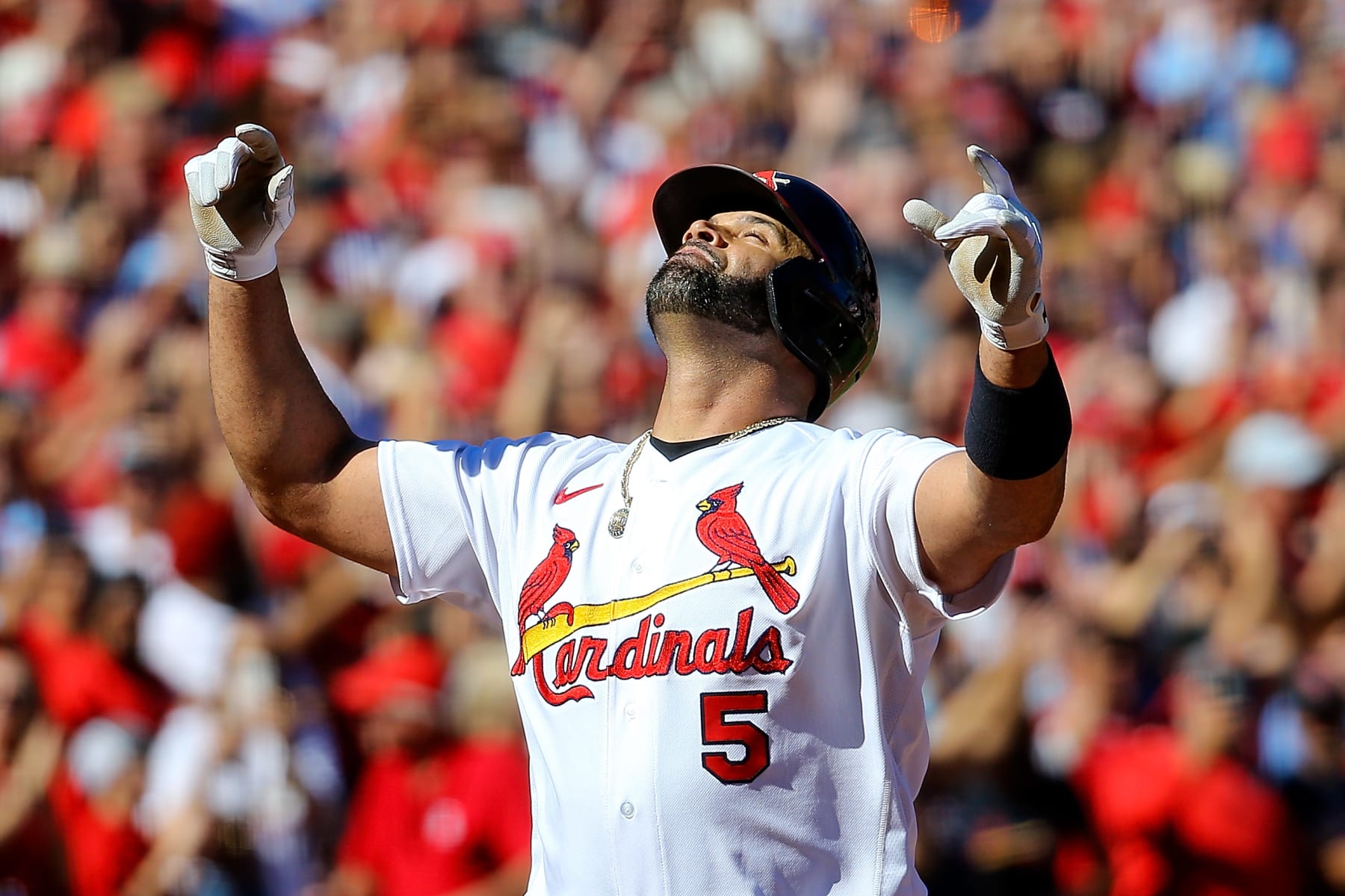 ST. LOUIS, MO - OCTOBER 02: Albert Pujols #5 of the St. Louis Cardinals gestures skyward after hitting a solo home run during the third inning against the Pittsburgh Pirates at Busch Stadium on October 2, 2022 in St. Louis, Missouri. (Photo by Scott Kane/Getty Images)