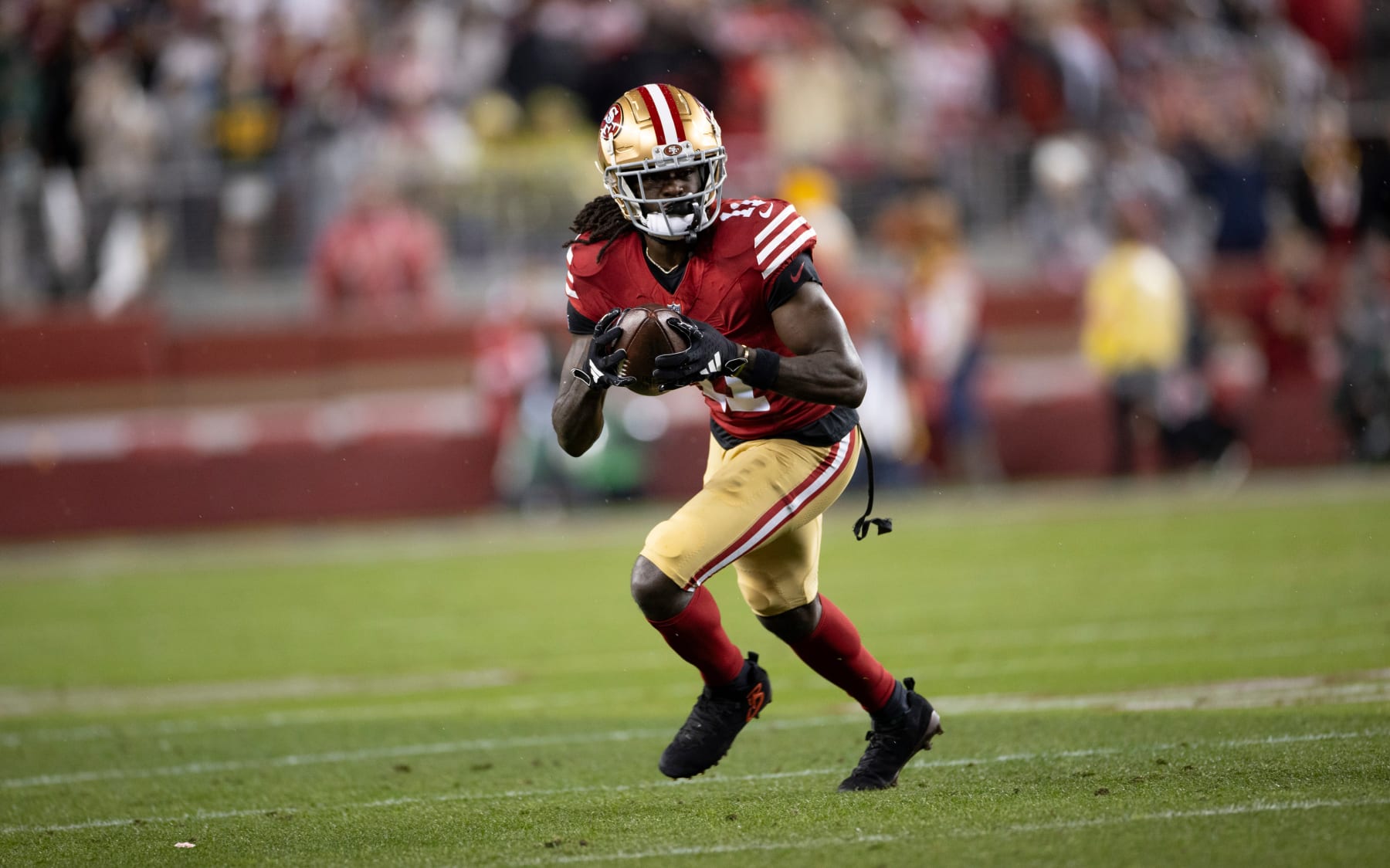 SANTA CLARA, CA - JANUARY 20: Brandon Aiyuk #11 of the San Francisco 49ers runs after making a catch during the NFC Divisional Playoff game against the Green Bay Packers at Levi's Stadium on January 20, 2024 in Santa Clara, California. (Photo by Michael Zagaris/San Francisco 49ers/Getty Images)