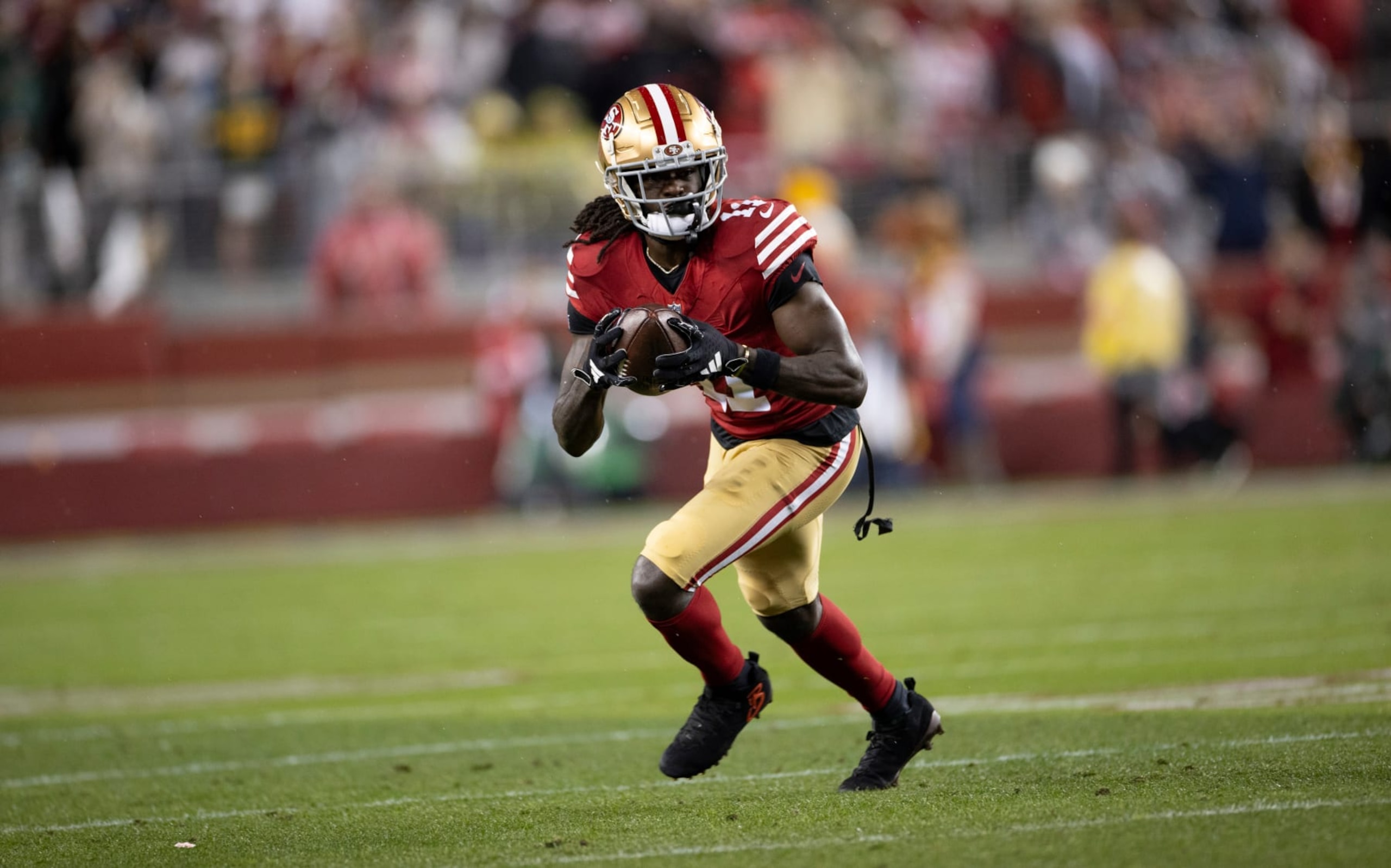 SANTA CLARA, CA - JANUARY 20: Brandon Aiyuk #11 of the San Francisco 49ers runs after making a catch during the NFC Divisional Playoff game against the Green Bay Packers at Levi's Stadium on January 20, 2024 in Santa Clara, California. (Photo by Michael Zagaris/San Francisco 49ers/Getty Images)