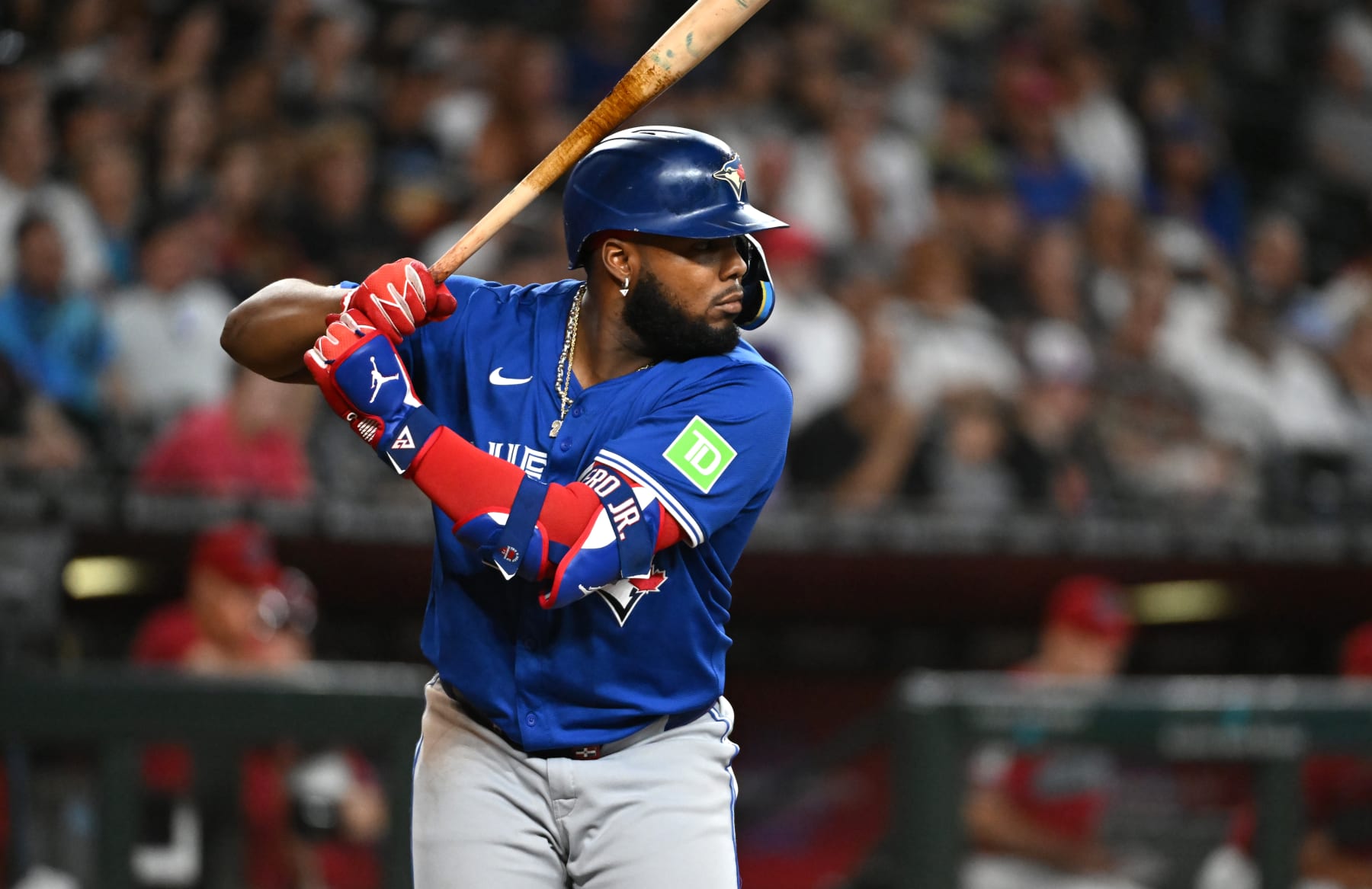 PHOENIX, ARIZONA - JULY 14: Vladimir Guerrero Jr #27 of the Toronto Blue Jays gets ready in the batters box against the Arizona Diamondbacks at Chase Field on July 14, 2024 in Phoenix, Arizona. (Photo by Norm Hall/Getty Images)