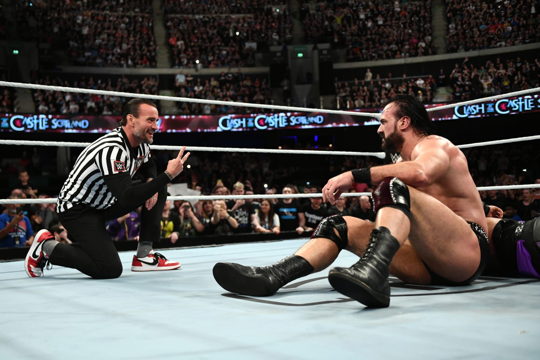 GLASGOW, SCOTLAND - JUNE 15: CM Punk taunts Drew McIntyre after Punk interfered with McIntyre's match against Damian Priest during WWE's Clash at the Castle, Premium Live Event at The OVO Hydro on June 15, 2024 in Glasgow, Scotland. (Photo by WWE/Getty Images)