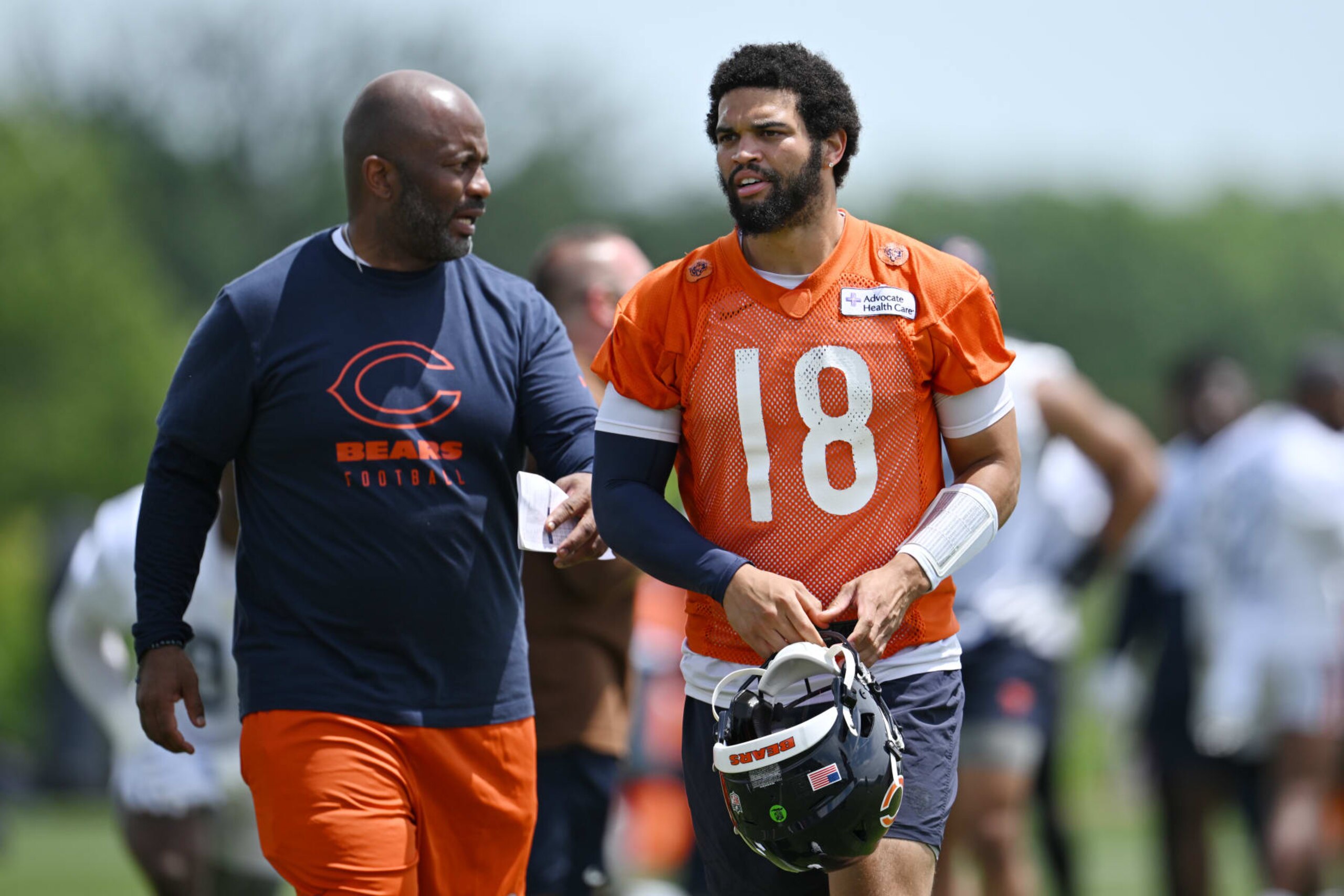 LAKE FOREST, ILLINOIS - JUNE 05: quarterback coach Kerry Joseph and Caleb Williams #18 of the Chicago Bears look on during the Chicago Bears mandatory minicamp at Halas Hall on June 05, 2024 in Lake Forest, Illinois. (Photo by Quinn Harris/Getty Images)