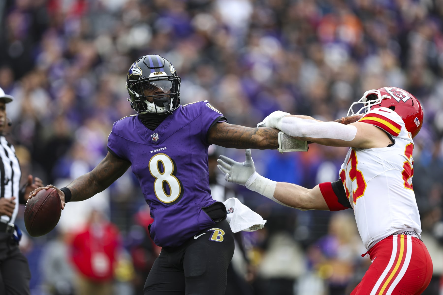 BALTIMORE, MD - JANUARY 28: Lamar Jackson #8 of the Baltimore Ravens drops back to pass during the AFC Championship NFL football game against the Kansas City Chiefs at M&T Bank Stadium on January 28, 2024 in Baltimore, Maryland. (Photo by Perry Knotts/Getty Images)