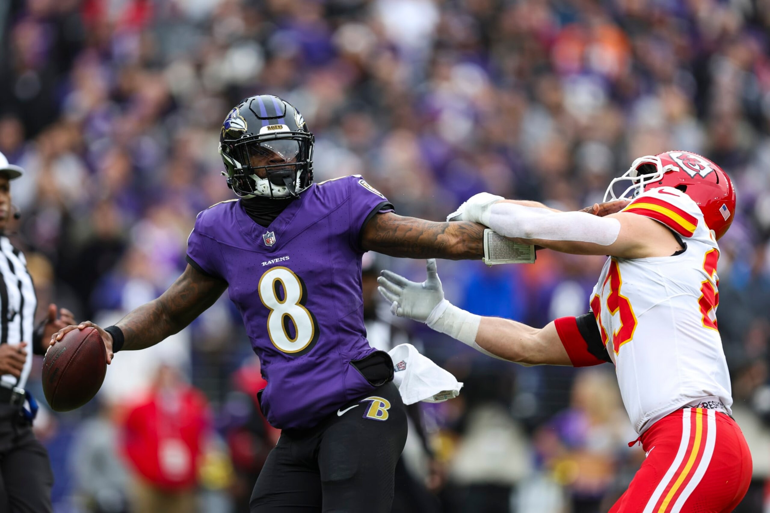 BALTIMORE, MD - JANUARY 28: Lamar Jackson #8 of the Baltimore Ravens drops back to pass during the AFC Championship NFL football game against the Kansas City Chiefs at M&T Bank Stadium on January 28, 2024 in Baltimore, Maryland. (Photo by Perry Knotts/Getty Images)