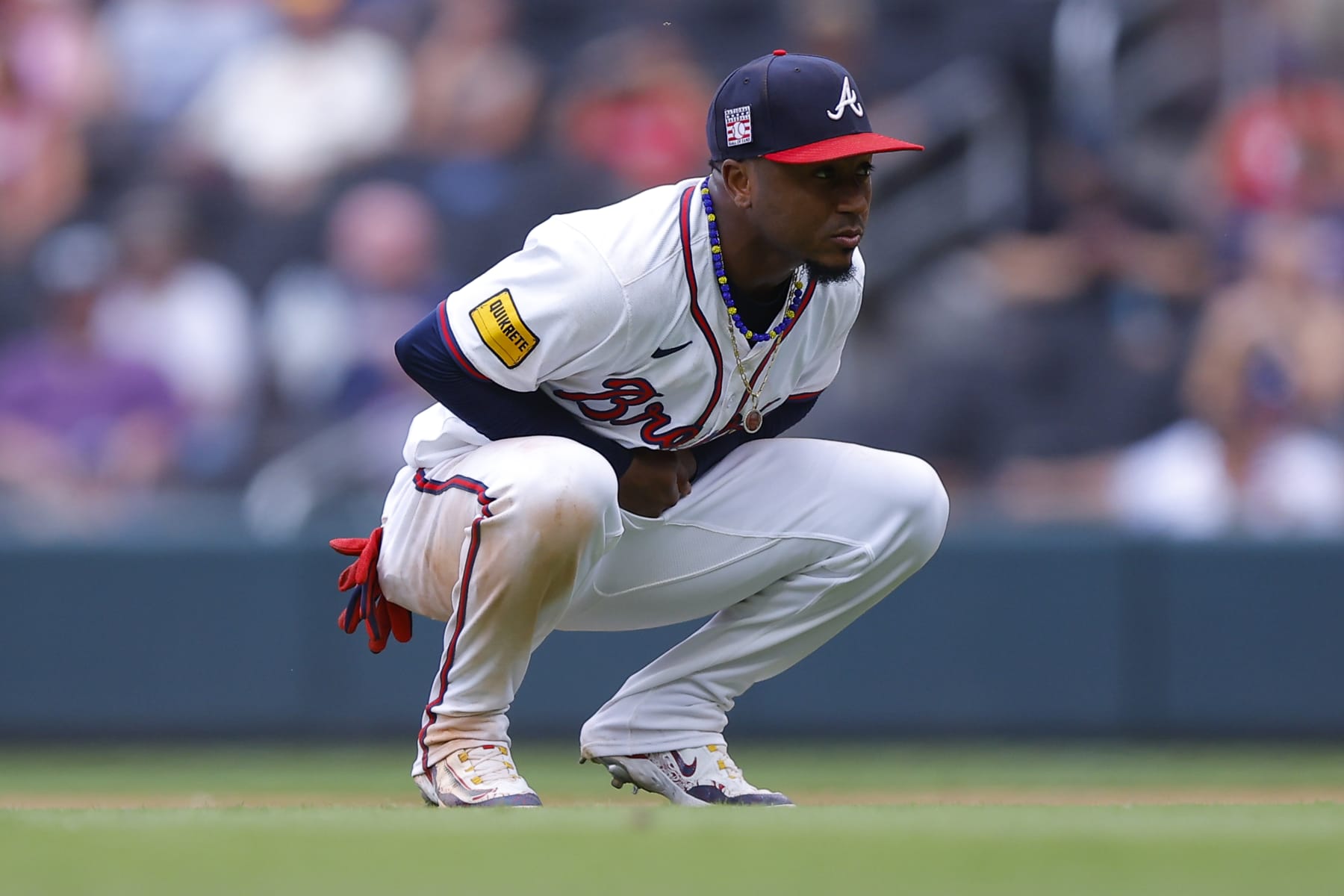 ATLANTA, GEORGIA - JULY 21: Ozzie Albies #1 of the Atlanta Braves reacts after an injury during the ninth inning against the St. Louis Cardinals at Truist Park on July 21, 2024 in Atlanta, Georgia. (Photo by Todd Kirkland/Getty Images)