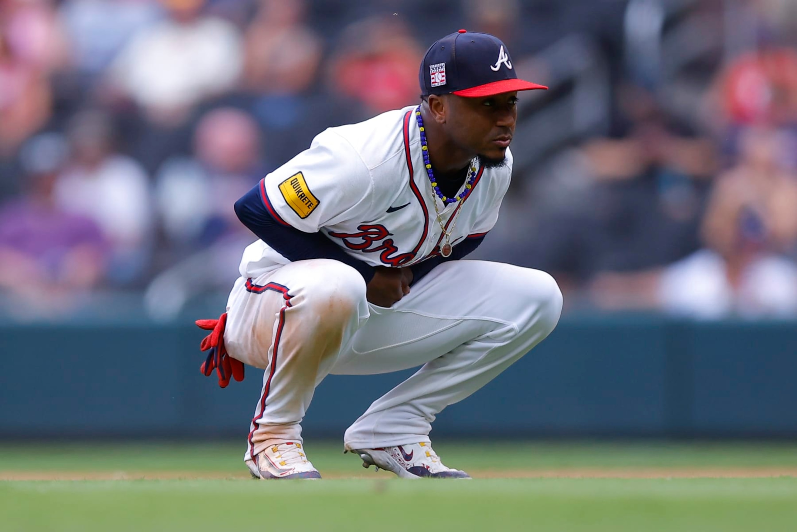 ATLANTA, GEORGIA - JULY 21: Ozzie Albies #1 of the Atlanta Braves reacts after an injury during the ninth inning against the St. Louis Cardinals at Truist Park on July 21, 2024 in Atlanta, Georgia. (Photo by Todd Kirkland/Getty Images)