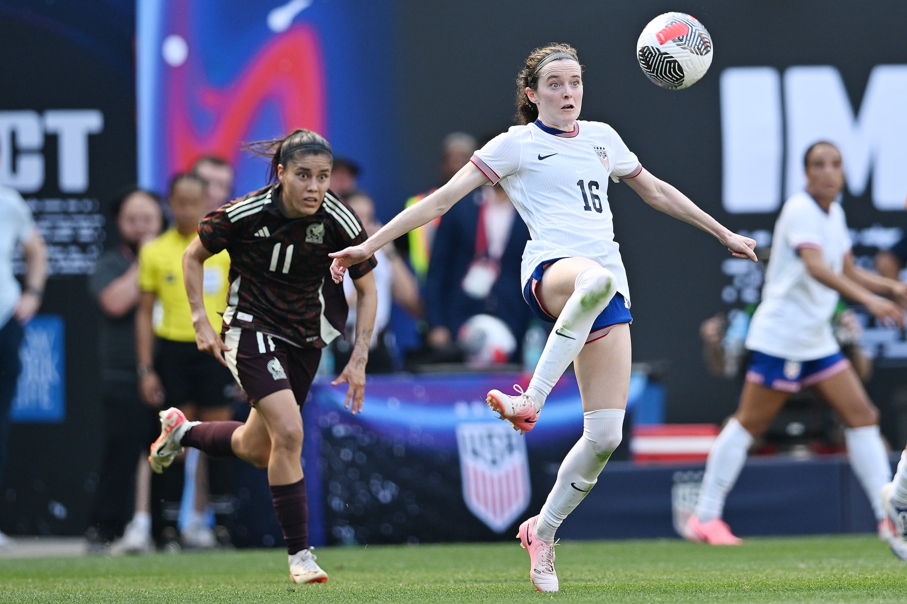 HARRISON, NEW JERSEY - JULY 13: Rose Lavelle #16 of the United States controls the ball against Lizbeth Ovalle #11 of Mexico during the first half at Red Bull Arena on July 13, 2024 in Harrison, New Jersey. (Photo by Stephen Nadler/ISI Photos/USSF/Getty Images for USSF)