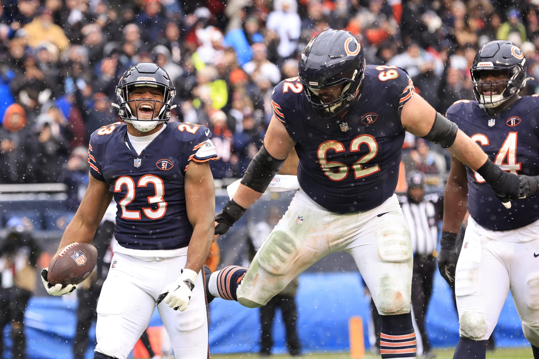 CHICAGO, ILLINOIS - DECEMBER 31: Roschon Johnson #23 of the Chicago Bears celebrates after a touchdown with Lucas Patrick #62 in the game against the Atlanta Falcons at Soldier Field on December 31, 2023 in Chicago, Illinois. (Photo by Justin Casterline/Getty Images)