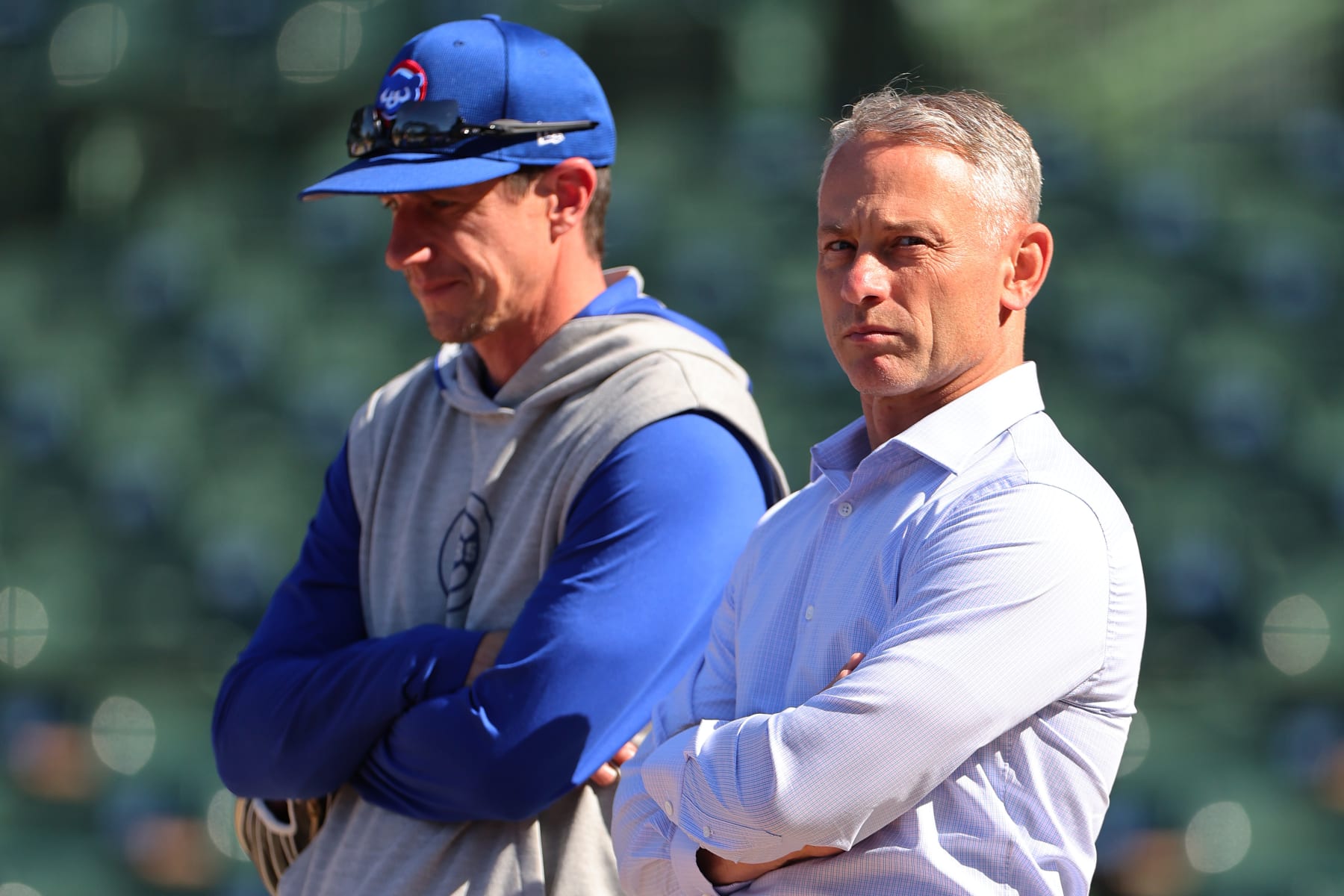 CHICAGO, ILLINOIS - MAY 22: Manager Craig Counsell #30 of the Chicago Cubs talks with President Jed Hoyer during batting practice prior to the game against the Atlanta Braves at Wrigley Field on May 22, 2024 in Chicago, Illinois. (Photo by Michael Reaves/Getty Images)