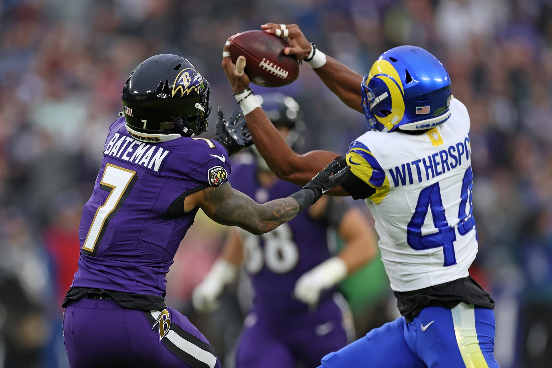 BALTIMORE, MARYLAND - DECEMBER 10: Ahkello Witherspoon #44 of the Los Angeles Rams intercepts a pass intended for Rashod Bateman #7 of the Baltimore Ravens during the first half at M&T Bank Stadium on December 10, 2023 in Baltimore, Maryland. (Photo by Todd Olszewski/Getty Images)