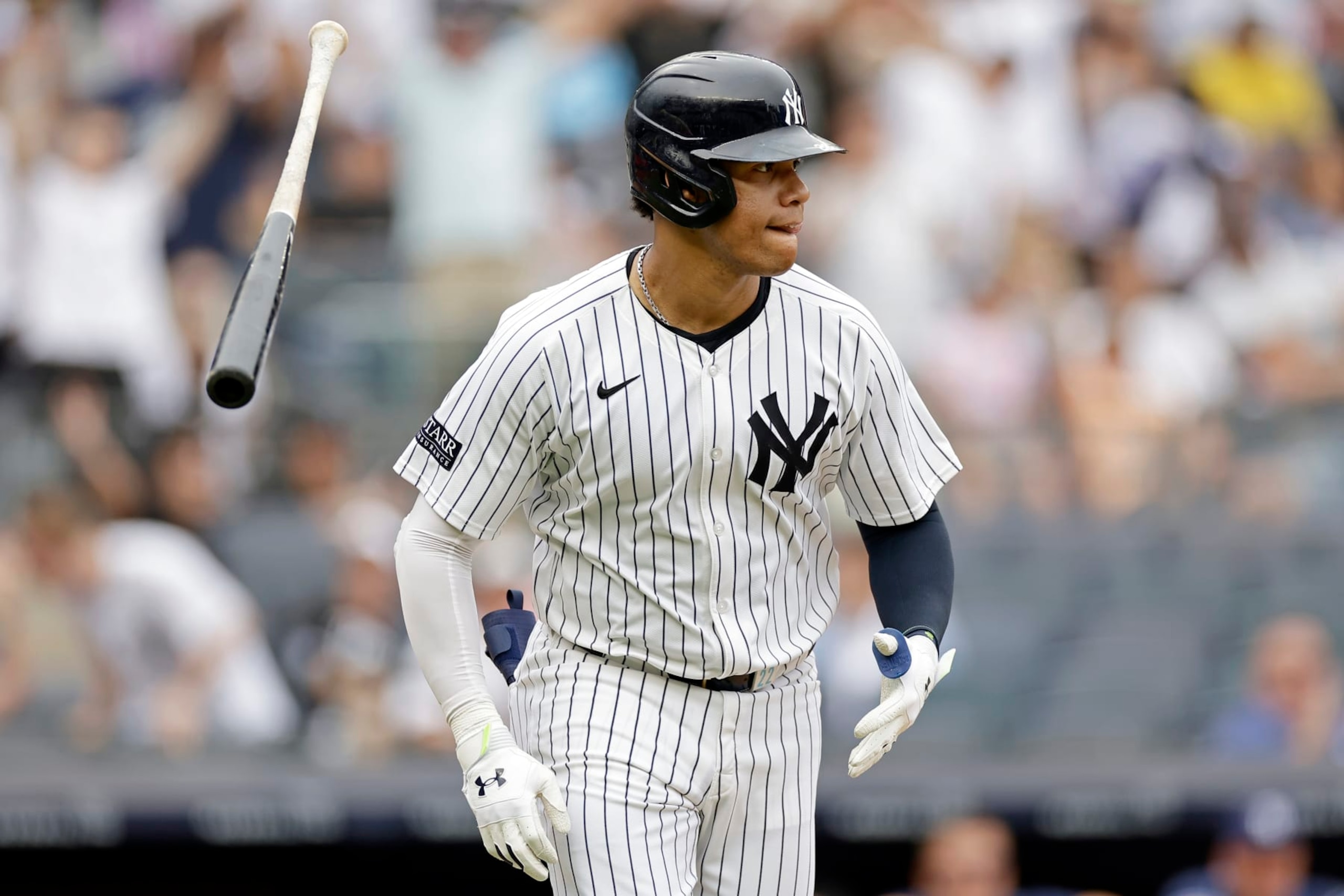 NEW YORK, NY - JULY 22: Juan Soto #22 of the New York Yankees reacts after hitting a solo home run during the seventh inning against the Tampa Bay Rays at Yankee Stadium on July 22, 2024 in New York City. The Yankees won 9-1. (Photo by Adam Hunger/Getty Images)