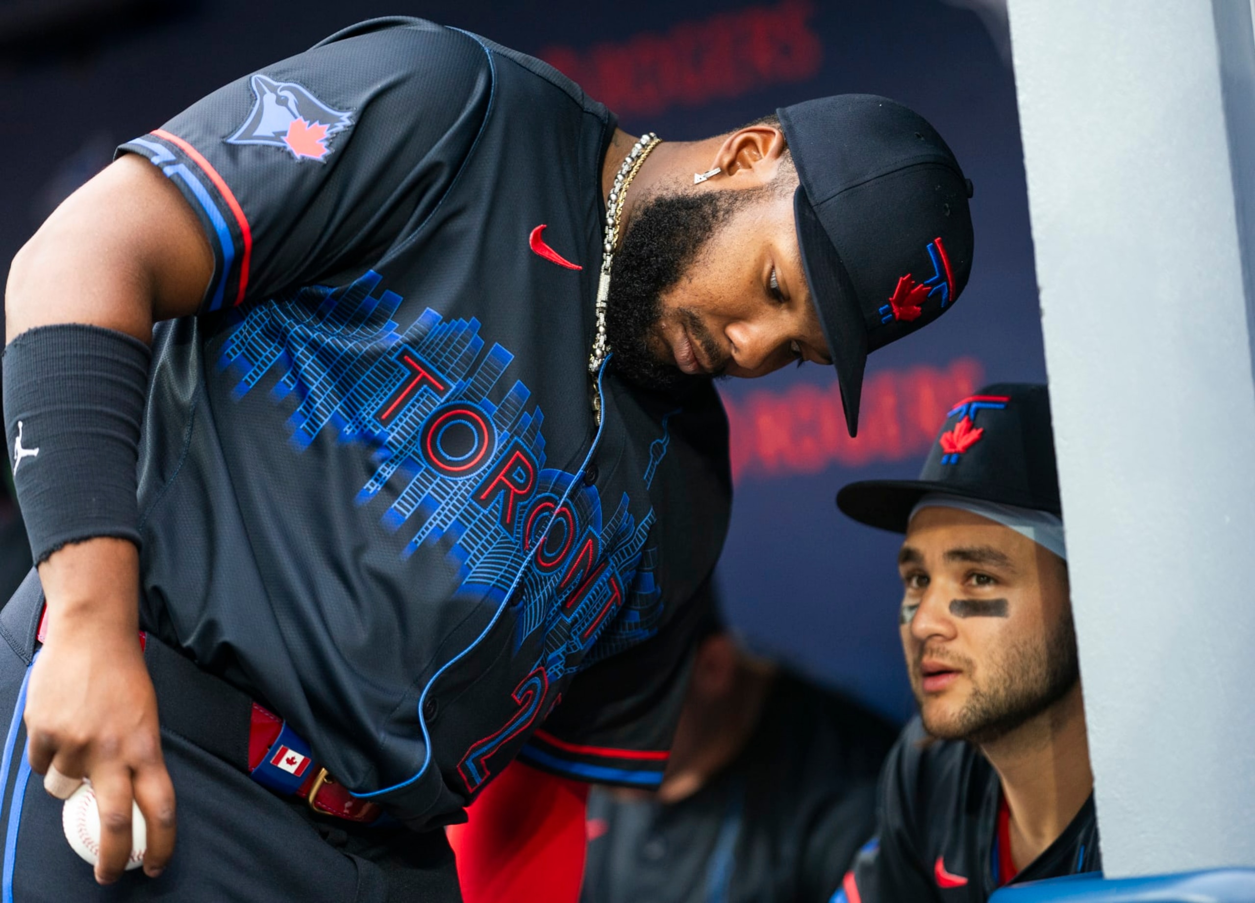 TORONTO, ON - JULY 3: Vladimir Guerrero Jr. #27 and Bo Bichette #11 of the Toronto Blue Jays speak in the dugout before playing the Houston Astros in their MLB game at the Rogers Centre on July 3, 2024 in Toronto, Ontario, Canada. (Photo by Mark Blinch/Getty Images) TORONTO, ON - JULY 3: Vladimir Guerrero Jr. #27 and Bo Bichette #11 of the Toronto Blue Jays speak in the dugout before playing the Houston Astros in their MLB game at the Rogers Centre on July 3, 2024 in Toronto, Ontario, Canada. (Photo by Mark Blinch/Getty Images)