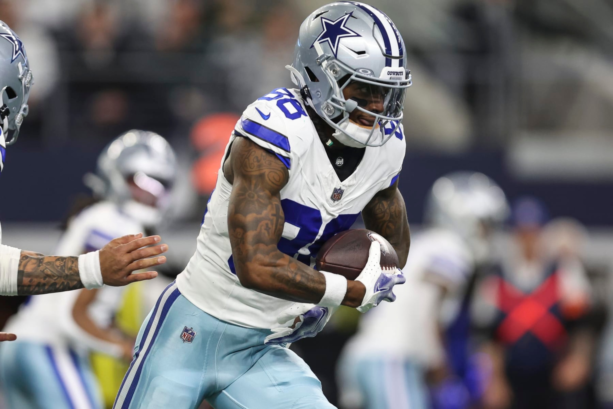 ARLINGTON, TX - JANUARY 14: CeeDee Lamb #88 of the Dallas Cowboys runs the ball during an NFL wild-card playoff football game against the Green Bay Packers at AT&T Stadium on January 14, 2024 in Arlington, Texas. (Photo by Perry Knotts/Getty Images)