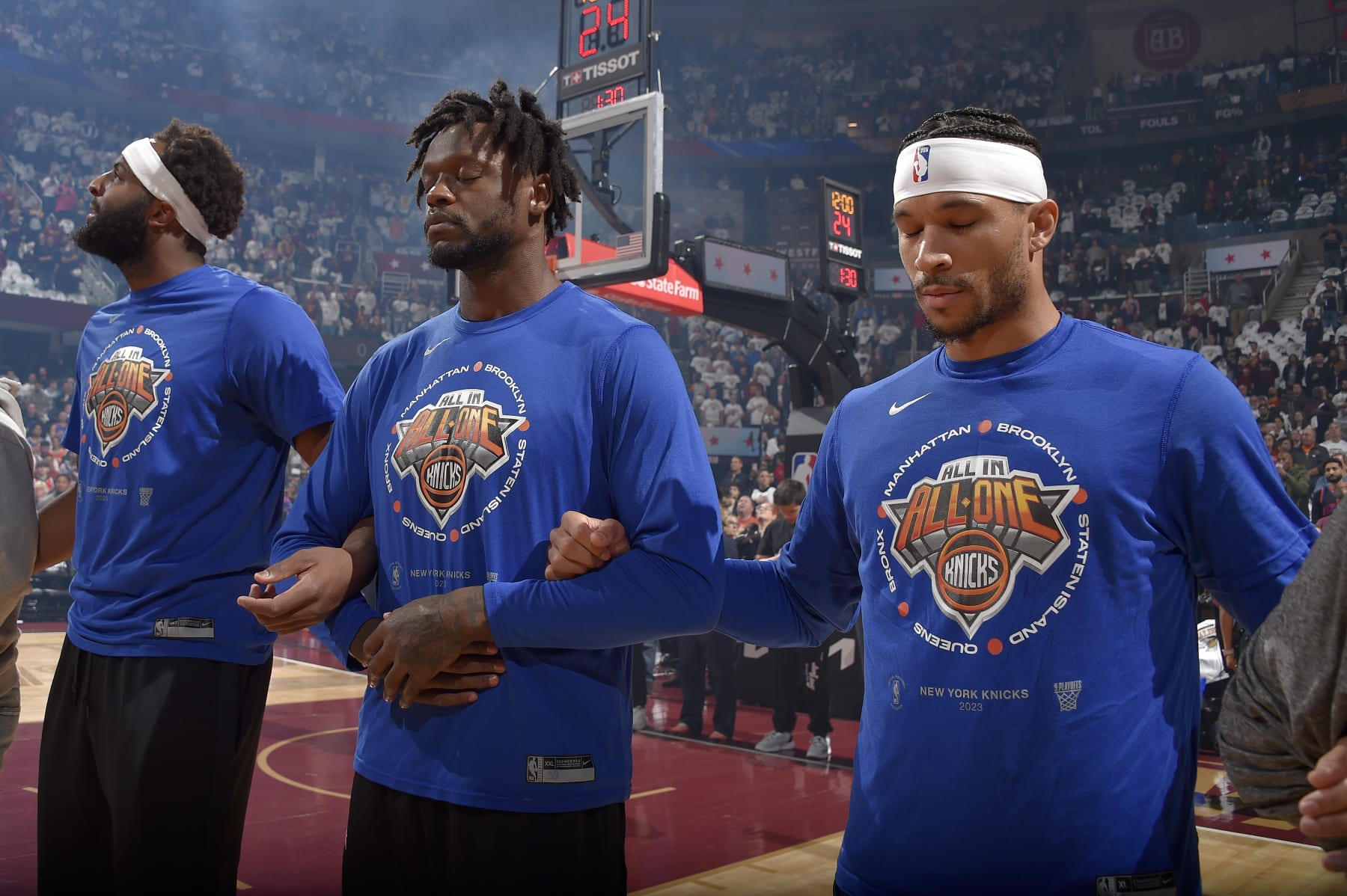 CLEVELAND, OH - APRIL 26: Mitchell Robinson #23, Julius Randle #30 and Josh Hart #3 of the New York Knicks stands for the National Anthem before the game against the Cleveland Cavaliers during round 1 Game 5 of the 2023 NBA Playoffs on April 26, 2023 at Rocket Mortgage FieldHouse in Cleveland, Ohio. NOTE TO USER: User expressly acknowledges and agrees that, by downloading and/or using this Photograph, user is consenting to the terms and conditions of the Getty Images License Agreement. Mandatory Copyright Notice: Copyright 2023 NBAE (Photo by David Liam Kyle/NBAE via Getty Images)