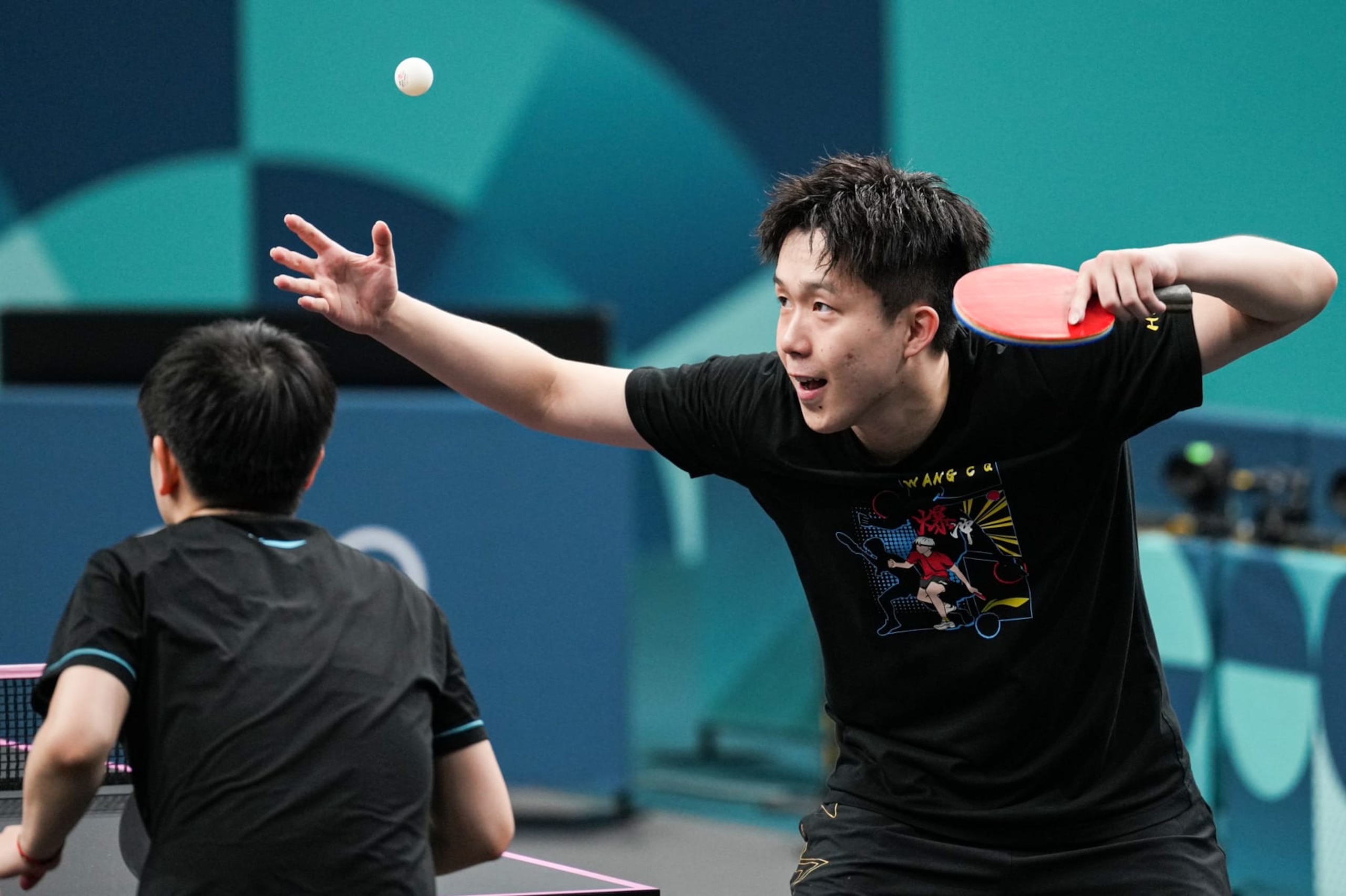 PARIS, FRANCE - JULY 23: Table tennis players Wang Chuqin and Sun Yingsha of Team China attend a training session at the South Paris Arena ahead of the Paris 2024 Olympic Games on July 23, 2024 in Paris, France. The Paris Olympics will be held from July 26 to August 11. (Photo by Bai Yu/CHINASPORTS/VCG via Getty Images)