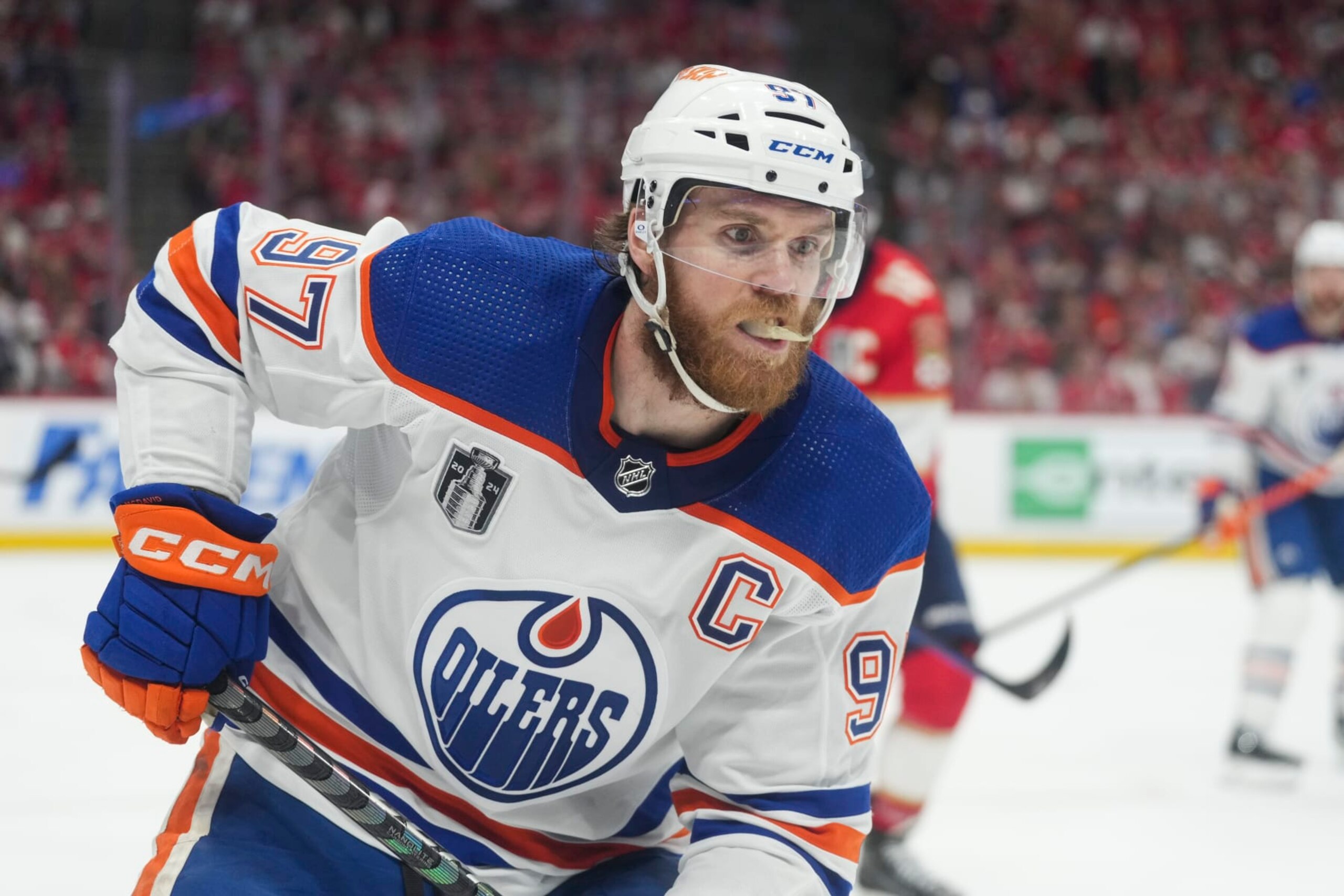 SUNRISE, FL - JUNE 24: Edmonton Oilers center Connor McDavid (97) collects a loose puck in the first period during game seven of the Stanley Cup Finals between the Edmonton Oilers and the Florida Panthers on Monday, June 24, 2024  at Amerant Bank Arena in Sunrise, Fla. (Photo by Peter Joneleit/Icon Sportswire via Getty Images)
