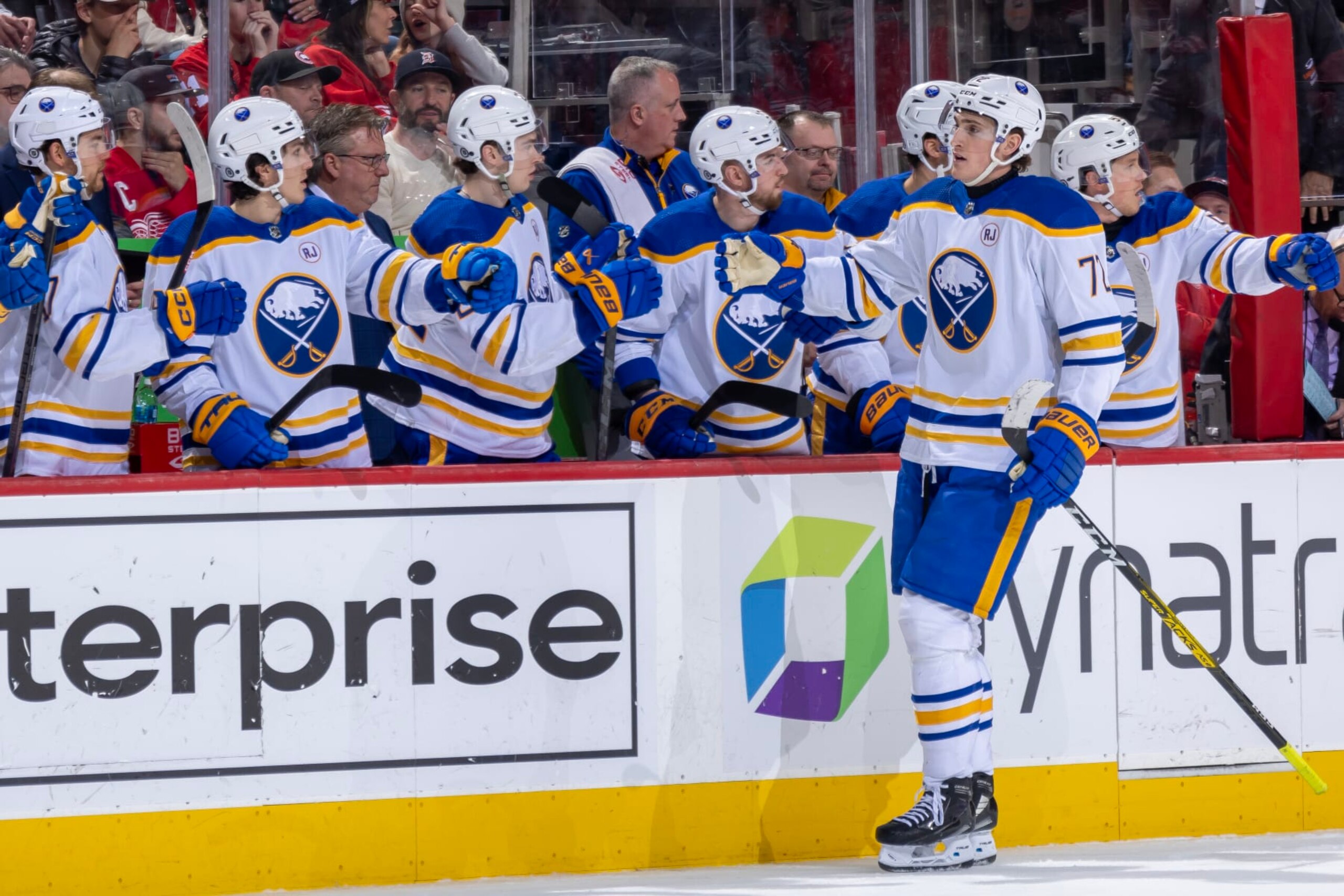 DETROIT, MI - APRIL 07: Tage Thompson #72 of the Buffalo Sabres pounds gloves with teammates on the bench after his goal against the Detroit Red Wings during the first period at Little Caesars Arena on April 7, 2024 in Detroit, Michigan. Detroit defeated Buffalo 3-1. (Photo by Dave Reginek/NHLI via Getty Images)