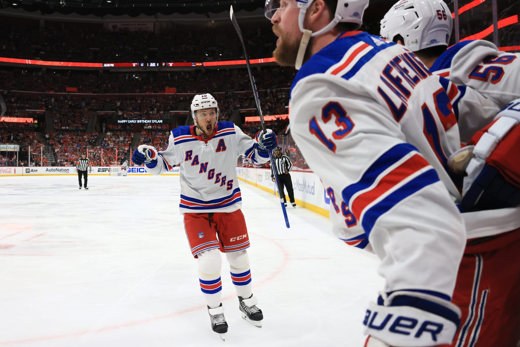 SUNRISE, FLORIDA - MAY 28:  Artemi Panarin #10 of the New York Rangers celebrates a goal by teammate Alexis Lafrenière #13 against the Florida Panthers during the third period in Game Four of the Eastern Conference Final of the 2024 Stanley Cup Playoffs at Amerant Bank Arena on May 28, 2024 in Sunrise, Florida.  (Photo by Bruce Bennett/Getty Images)