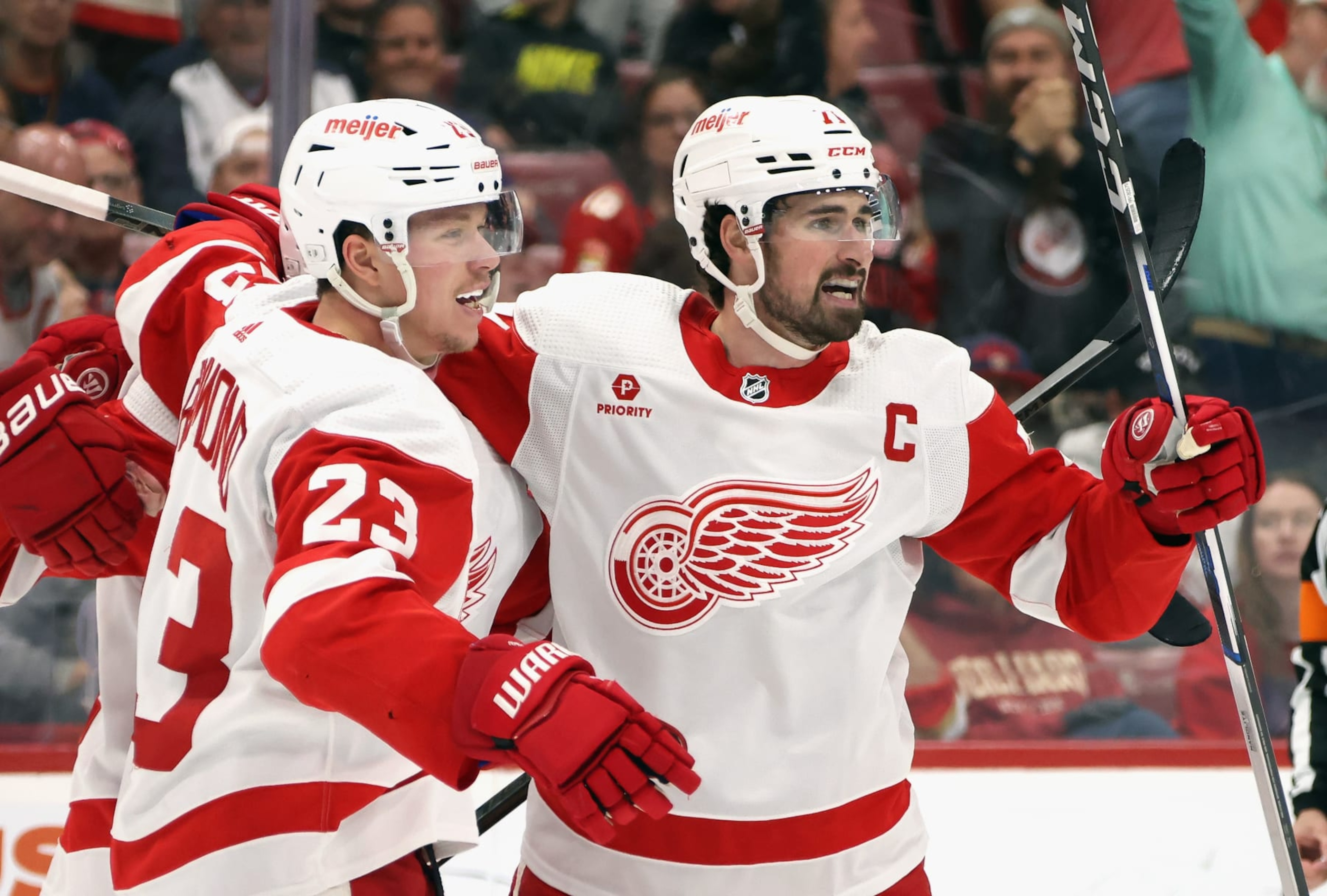 SUNRISE, FLORIDA - MARCH 30: Dylan Larkin #71 of the Detroit Red Wings (R) celebrates his powerplay goal against the Florida Panthers at 16:00 of the third period and is joined by Lucas Raymond #23 (L) at Amerant Bank Arena on March 30, 2024 in Sunrise, Florida. The Panthers defeated the Red Wings 3-2 in the shootout. (Photo by Bruce Bennett/Getty Images) SUNRISE, FLORIDA - MARCH 30: Dylan Larkin #71 of the Detroit Red Wings (R) celebrates his powerplay goal against the Florida Panthers at 16:00 of the third period and is joined by Lucas Raymond #23 (L) at Amerant Bank Arena on March 30, 2024 in Sunrise, Florida. The Panthers defeated the Red Wings 3-2 in the shootout. (Photo by Bruce Bennett/Getty Images)