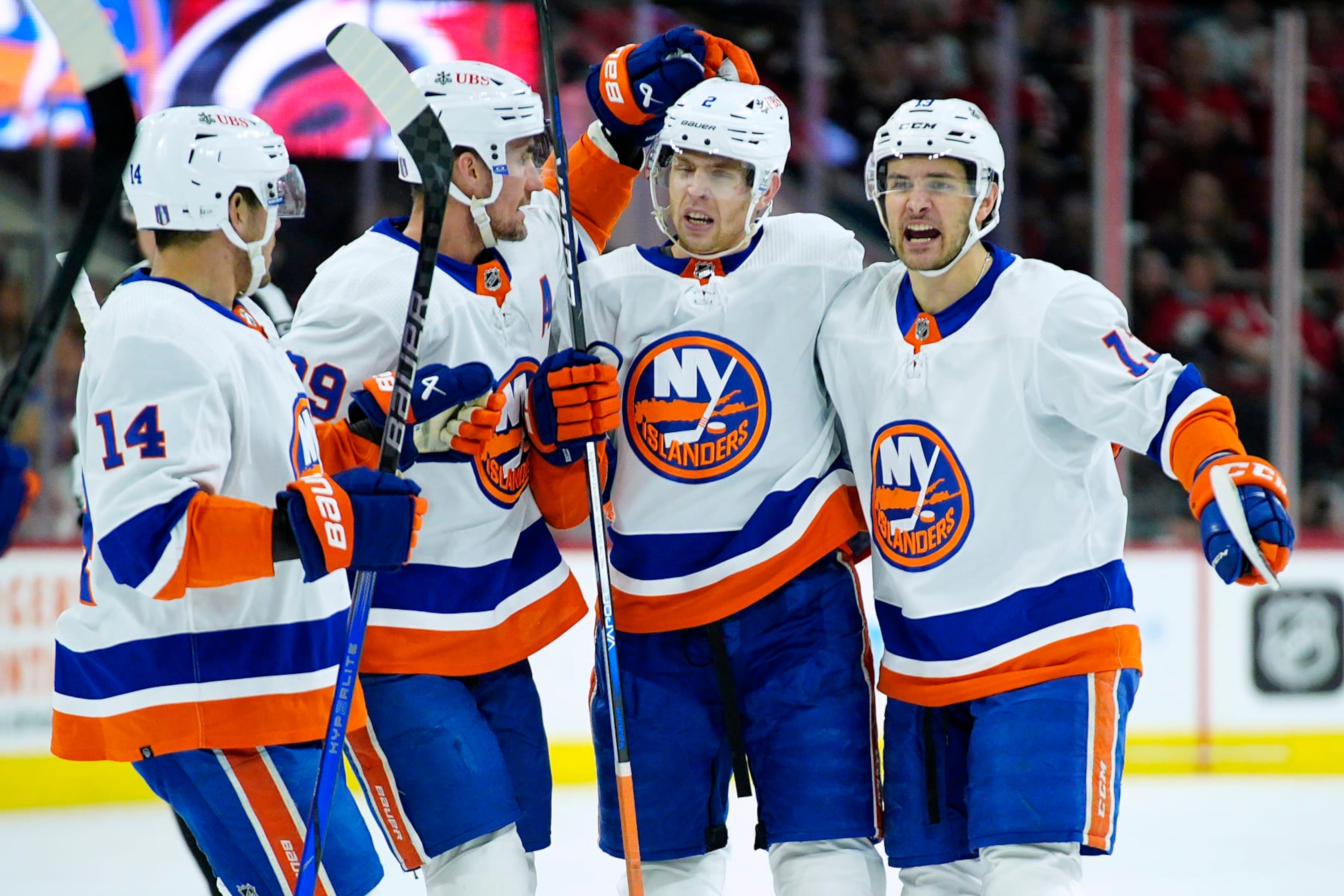 RALEIGH, NORTH CAROLINA - APRIL 30: Mike Reilly #2 of the New York Islanders celebrates with teammates Bo Horvat #14, Brock Nelson #29 and Mathew Barzal #13 after scoring a power play goal against the Carolina Hurricanes during the first period in Game Five of the First Round of the 2024 Stanley Cup Playoffs at PNC Arena on April 30, 2024 in Raleigh, North Carolina. (Photo by Grant Halverson/Getty Images) RALEIGH, NORTH CAROLINA - APRIL 30: Mike Reilly #2 of the New York Islanders celebrates with teammates Bo Horvat #14, Brock Nelson #29 and Mathew Barzal #13 after scoring a power play goal against the Carolina Hurricanes during the first period in Game Five of the First Round of the 2024 Stanley Cup Playoffs at PNC Arena on April 30, 2024 in Raleigh, North Carolina. (Photo by Grant Halverson/Getty Images)