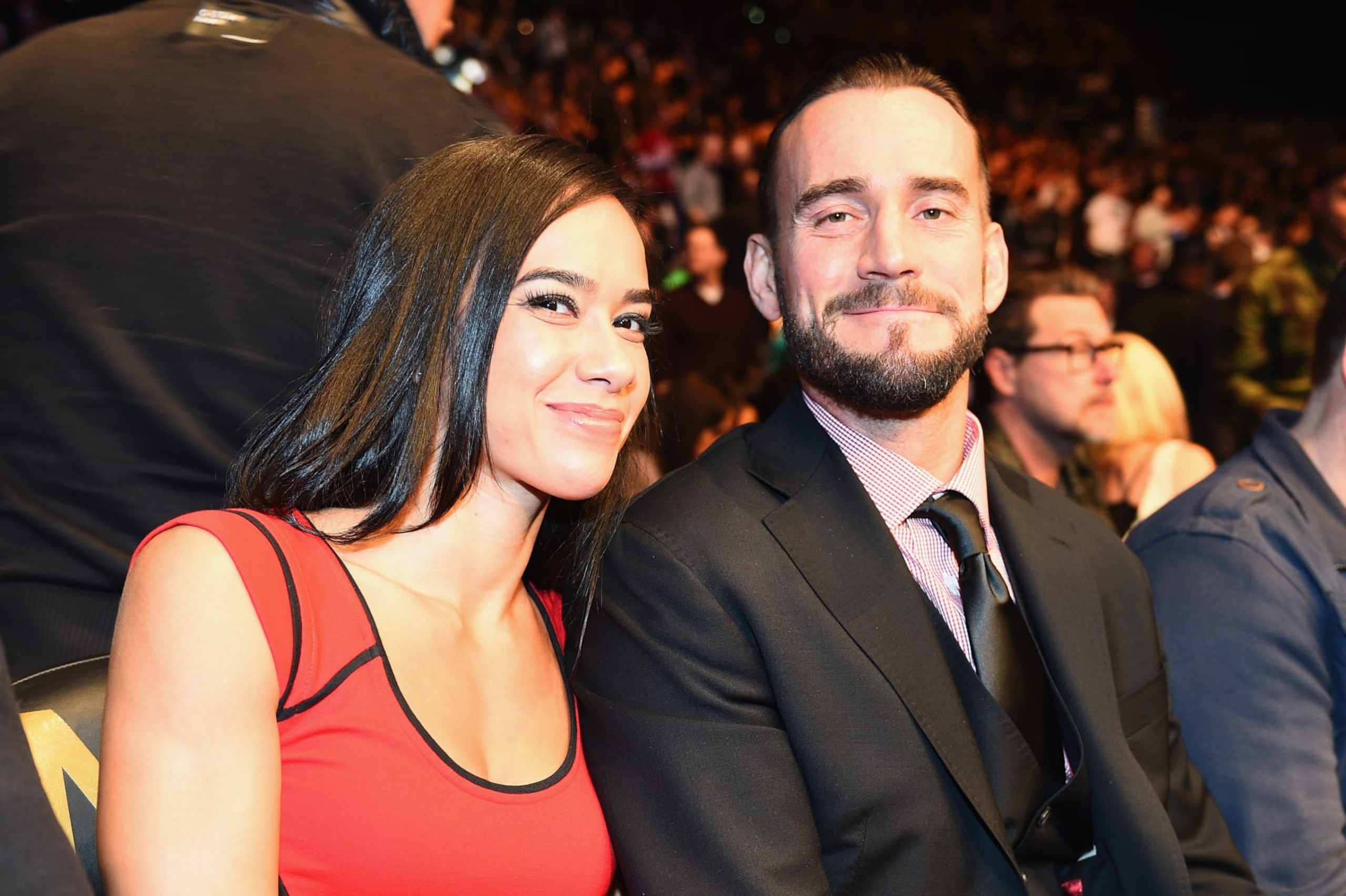 LAS VEGAS, NV - JANUARY 03:  Phil 
'CM Punk' Brooks (R) with wife AJ Lee (L) attends UFC 182 event at the MGM Grand Garden Arena on January 3, 2015 in Las Vegas, Nevada.  (Photo by Jeff Bottari/Zuffa LLC/Zuffa LLC via Getty Images)