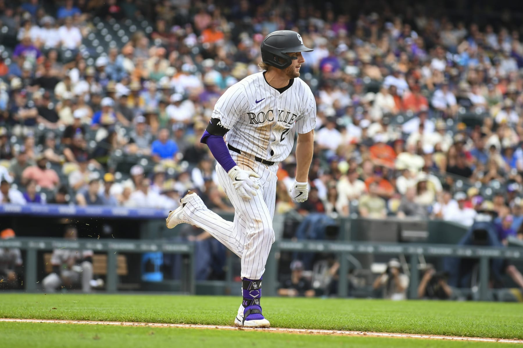 DENVER, CO - JULY 21: Colorado Rockies third baseman Ryan McMahon (24) sprints to first base during a game between the San Francisco Giants and the Colorado Rockies at Coors Field in Denver, CO on July 21, 2024. (Photo by Kevin Langley/Icon Sportswire via Getty Images)