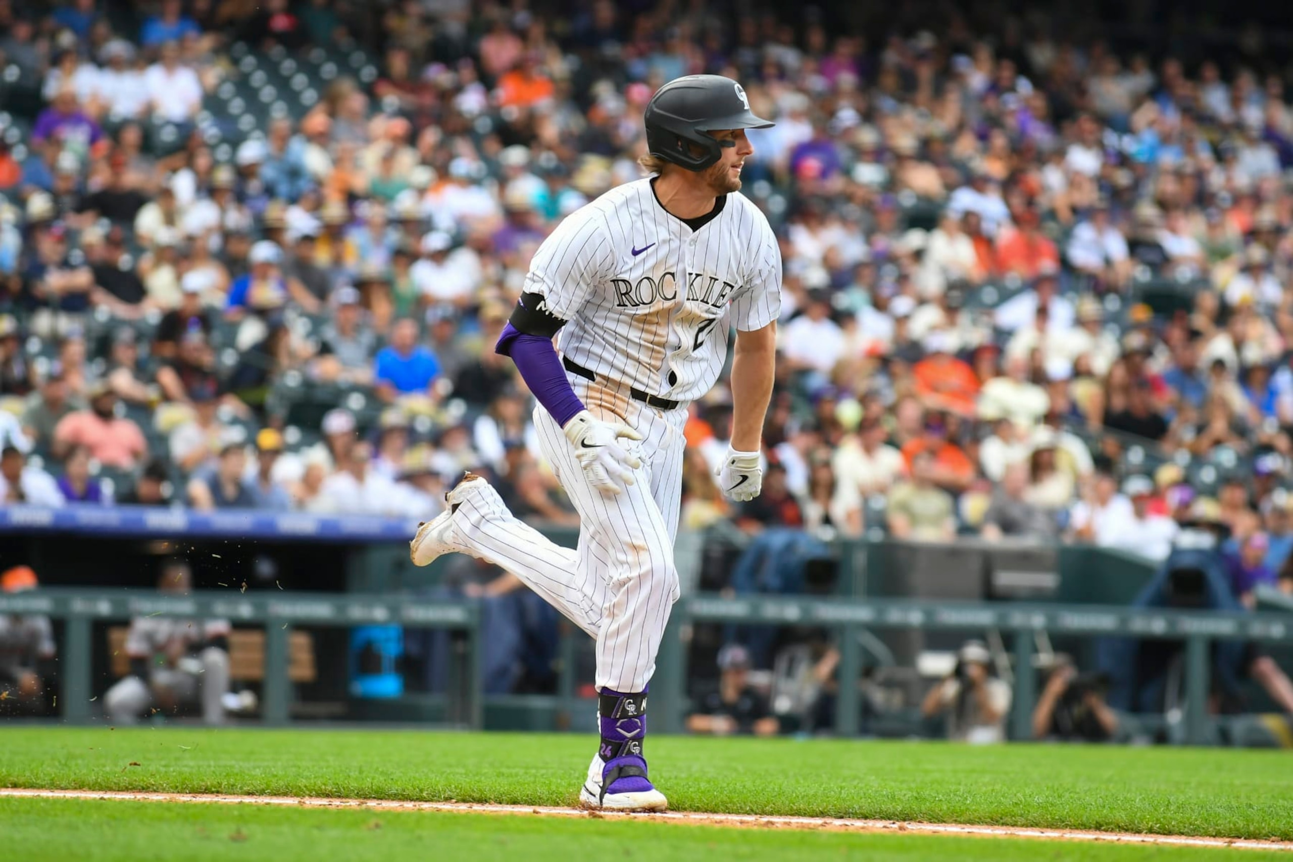 DENVER, CO - JULY 21: Colorado Rockies third baseman Ryan McMahon (24) sprints to first base during a game between the San Francisco Giants and the Colorado Rockies at Coors Field in Denver, CO on July 21, 2024. (Photo by Kevin Langley/Icon Sportswire via Getty Images)