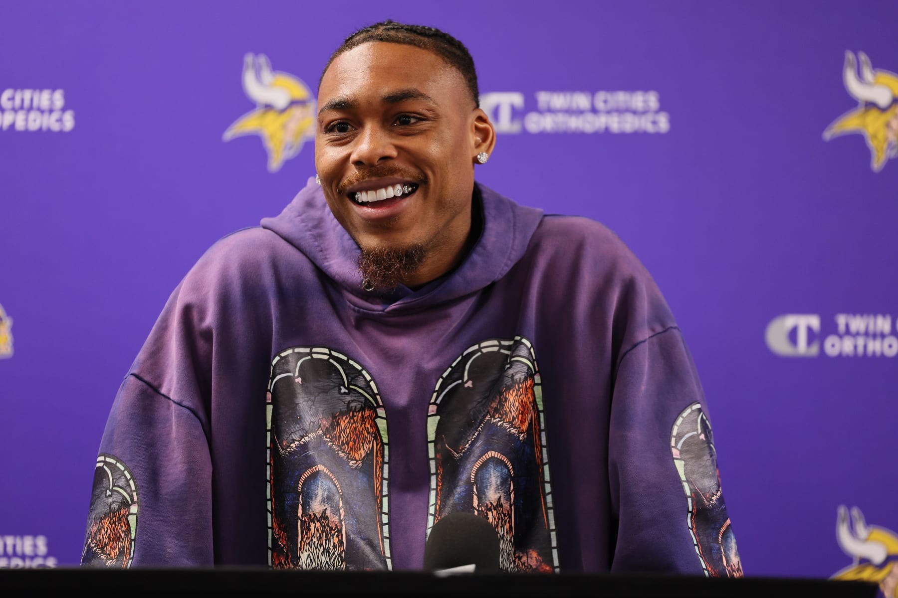 EAGAN, MINNESOTA - JUNE 04: Justin Jefferson #18 of the Minnesota Vikings addresses the media in a press conference announcing a $140 million, four year contract extension at Twin Cities Orthopedics Performance Center during Minnesota Vikings mandatory minicamp on June 04, 2024 in Eagan, Minnesota.(Photo by Adam Bettcher/Getty Images)