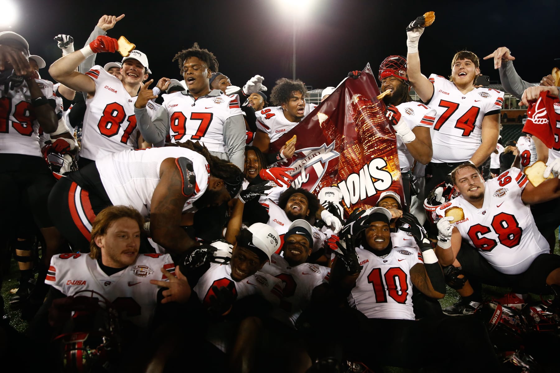 CHARLOTTE, NORTH CAROLINA - DECEMBER 18: The Western Kentucky Hilltoppers celebrate defeating the Old Dominion Monarchs 38-35 in overtime during the Famous Toastery Bowl at Jerry Richardson Stadium on December 18, 2023 in Charlotte, North Carolina. (Photo by Isaiah Vazquez/Getty Images)