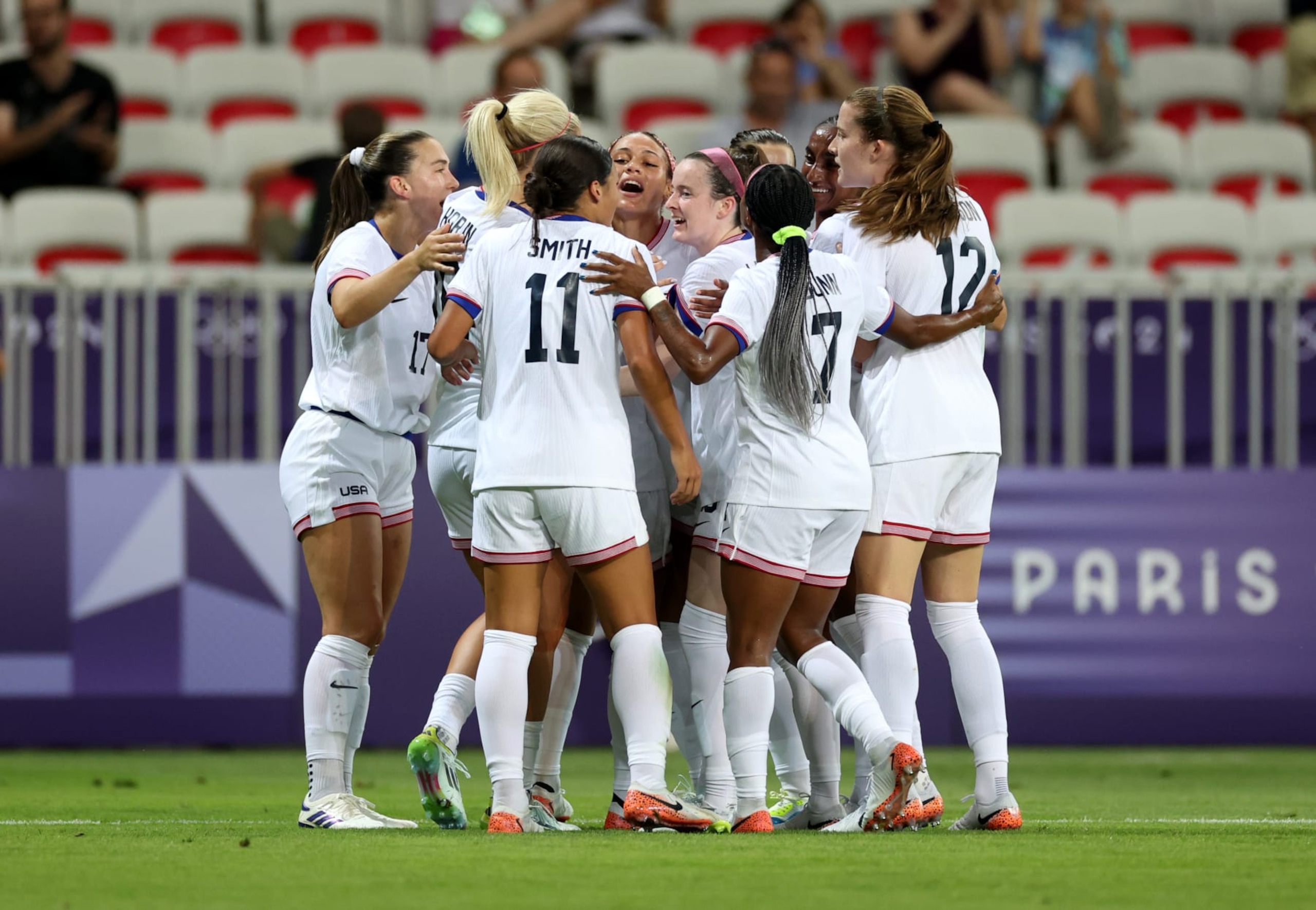 NICE, FRANCE - JULY 25: Trinity Rodman #5 of Team United States celebrates scoring her team's first goal with teammates during the Women's group B match between United States and Zambia during the Olympic Games Paris 2024 at Stade de Nice on July 25, 2024 in Nice, France. (Photo by Marc Atkins/Getty Images) NICE, FRANCE - JULY 25: Trinity Rodman #5 of Team United States celebrates scoring her team's first goal with teammates during the Women's group B match between United States and Zambia during the Olympic Games Paris 2024 at Stade de Nice on July 25, 2024 in Nice, France. (Photo by Marc Atkins/Getty Images)