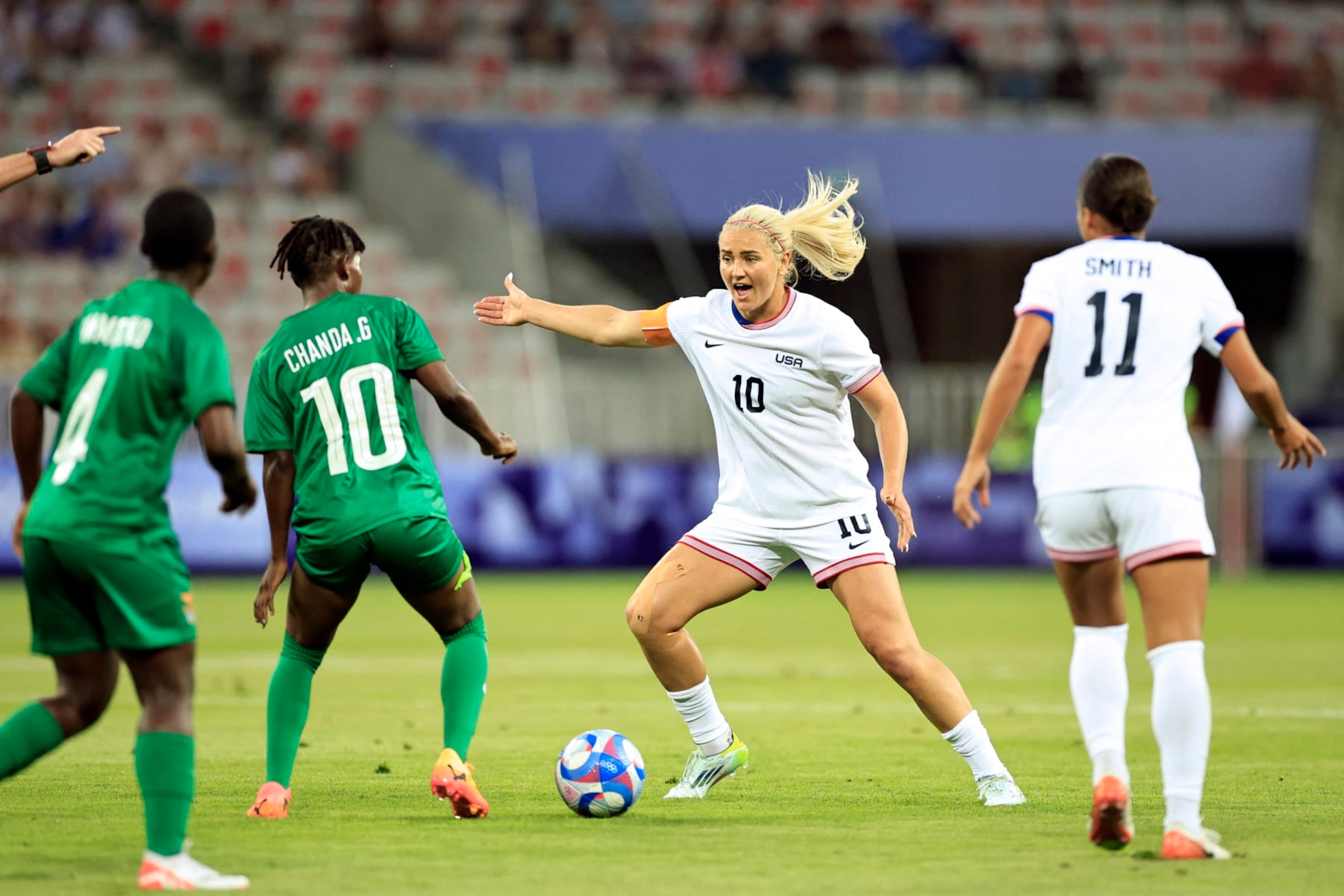 US' midfielder #10 Lindsey Horan is challenged by Zambia's midfielder #10 Grace Chanda in the women's group A football match between the USA and Zambia during the Paris 2024 Olympic Games at the Nice Stadium in Nice, on July 25, 2024. (Photo by Valery HACHE / AFP) (Photo by VALERY HACHE/AFP via Getty Images) US' midfielder #10 Lindsey Horan is challenged by Zambia's midfielder #10 Grace Chanda in the women's group A football match between the USA and Zambia during the Paris 2024 Olympic Games at the Nice Stadium in Nice, on July 25, 2024. (Photo by Valery HACHE / AFP) (Photo by VALERY HACHE/AFP via Getty Images)
