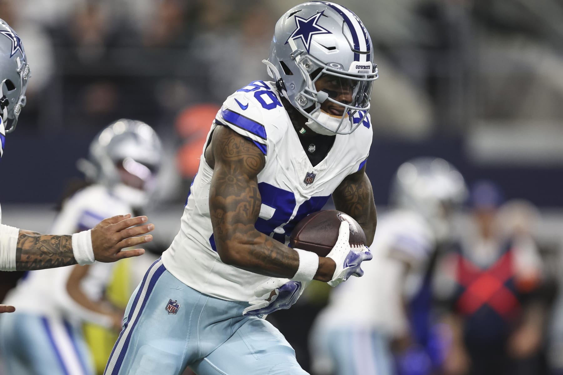 ARLINGTON, TX - JANUARY 14: CeeDee Lamb #88 of the Dallas Cowboys runs the ball during an NFL wild-card playoff football game against the Green Bay Packers at AT&T Stadium on January 14, 2024 in Arlington, Texas. (Photo by Perry Knotts/Getty Images)