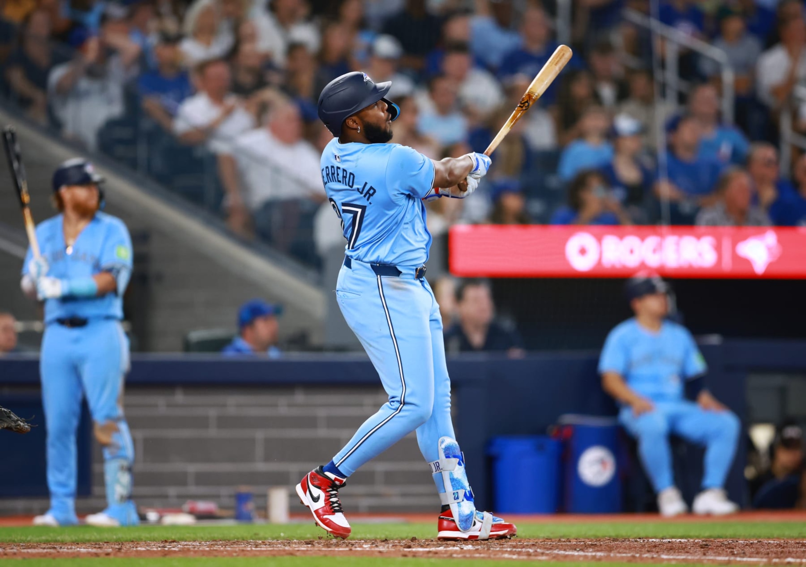 TORONTO, ON - JUNE 23: Vladimir Guerrero Jr. #27 of the Toronto Blue Jays hits a solo home run in the sixth inning during a game against the Tampa Bay Rays at Rogers Centre on June 23, 2024 in Toronto, Ontario, Canada. (Photo by Vaughn Ridley/Getty Images) TORONTO, ON - JUNE 23: Vladimir Guerrero Jr. #27 of the Toronto Blue Jays hits a solo home run in the sixth inning during a game against the Tampa Bay Rays at Rogers Centre on June 23, 2024 in Toronto, Ontario, Canada. (Photo by Vaughn Ridley/Getty Images)